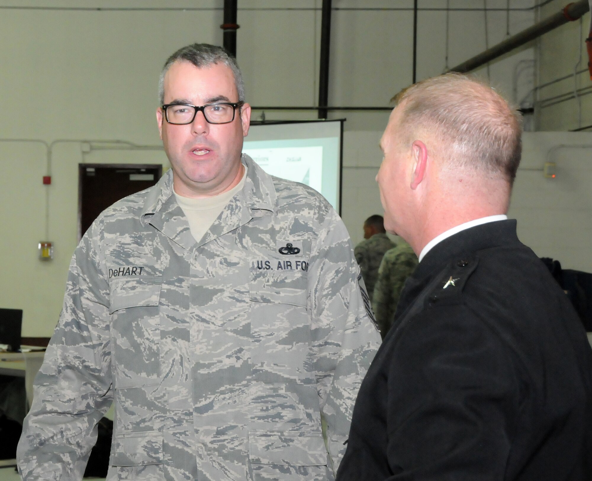 Brig. Gen. Timothy P. Williams, the Adjutant General of Virginia, meets with Airmen from the 192D Fighter Wing during the Wing’s third annual holiday celebration and awards event on December 6, 2014, at Langley Air Force Base. Williams congratulated award recipients, thanked members for their service and wished them a safe and happy holiday season.  (U.S. Air National Guard photo by Master Sgt. Carlos J. Claudio/Released)