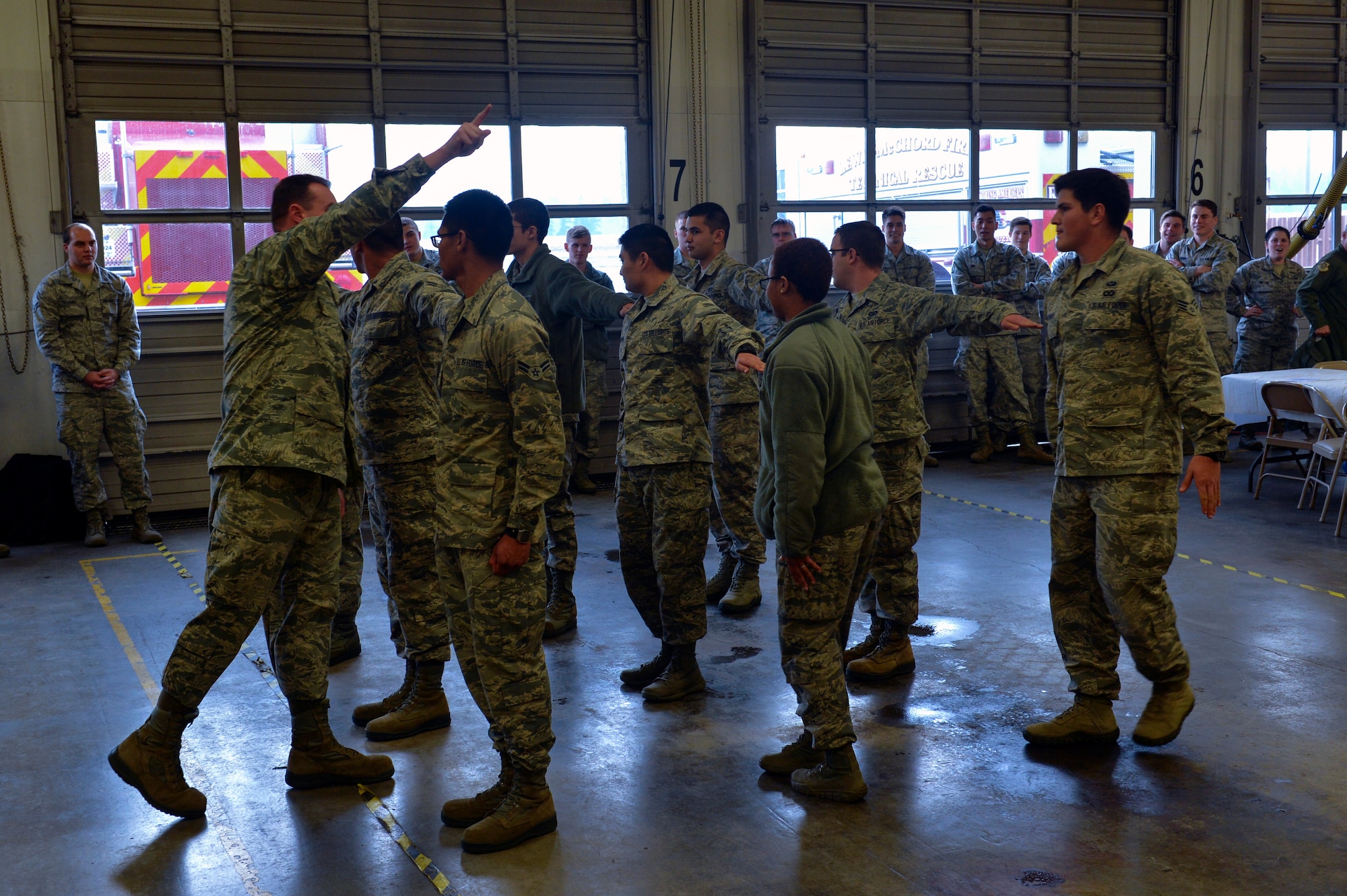 Master Sgt. Curtis Davis, 627 Logistics Readiness Squadron first sergeant, disqualifies an Airman from winning a PlayStation 4 for making an incorrect drill movement Dec. 5, 2014, during Team McChord’s First Sergeant’s Council Airman’s Feast at Joint Base Lewis-McChord, Wash. Davis, a former military training instructor was the ideal candidate for the drill knockout game as they let the most disciplined Airman earn the grand prize. (U.S. Air Force photo/Staff Sgt. Russ Jackson)