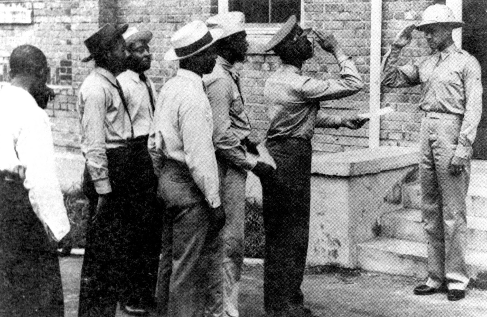 Capt. Benjamin O. Davis Jr. (right) greets some of the first aviation cadets at Tuskegee. (U.S. Air Force photo)