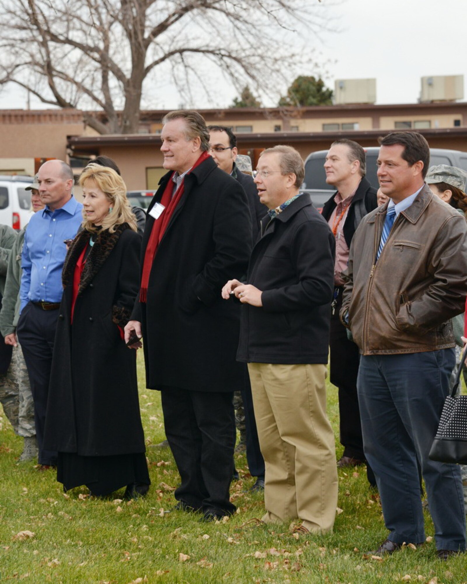 A group of Lovelace Health System employees watch a demonstration of Kirtland's military working dogs. The 377th Medical Group hosted a tour of Kirtland for employees to to help them better understand Kirtland’s mission and the demands of active duty. (Photo by Jamie Burnett)