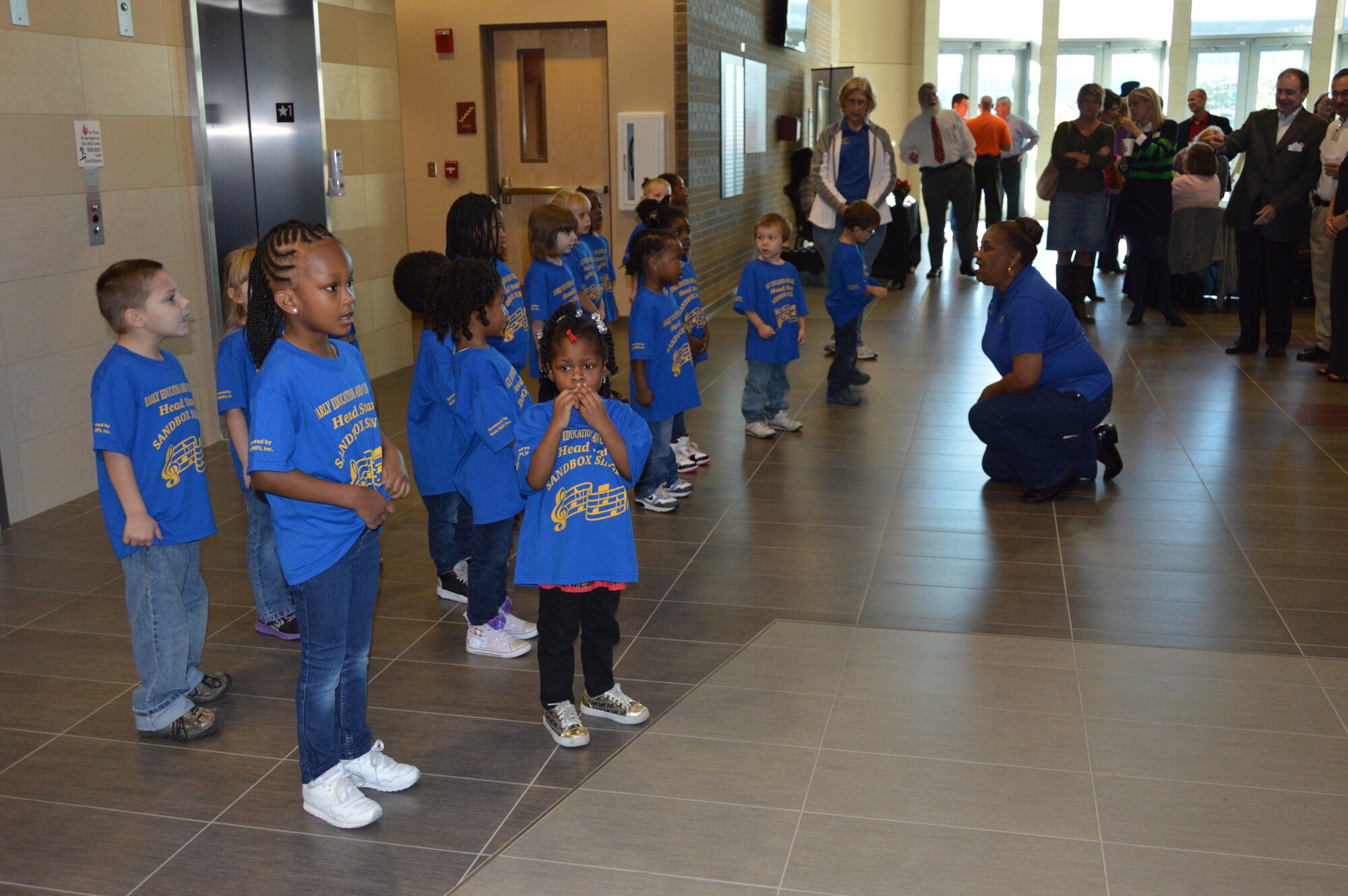 The Sandbox Singers, a group of youngsters from a local preschool, present their singing program at the Bay County Chamber of Commerce First Friday event Dec. 5. The monthly event, attended by civic leaders and business owners from throughout Bay County, also featured a presentation by BGen. Alain Pelletier, Continental U.S. North American Aerospace Defense Region Deputy Commander. The general briefed the audience about not only the NORAD Tracks Santa program, but the overall CONR mission as well. (Photo by Mary McHale)