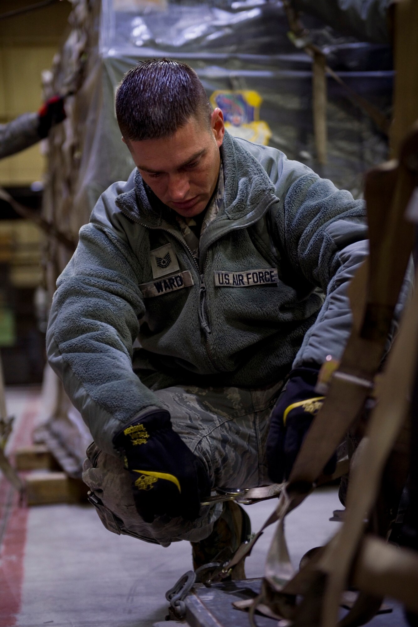Tech Sgt. Craig Ward, 434th Aircraft Maintenance Squadron KC-135 crew chief, uses a combination of tie-down techniques and pallet build-up techniques to secure cargo at Grissom Air Reserve Base, Ind., Nov. 1, 2014.The techniques were taught during a pallet building course that trains Airmen on the proper ways of loading cargo onto an aircraft using a combination of geometry, algebra and tie-down techniques. (U.S. Air Force photo/Staff Sgt. Benjamin Mota)