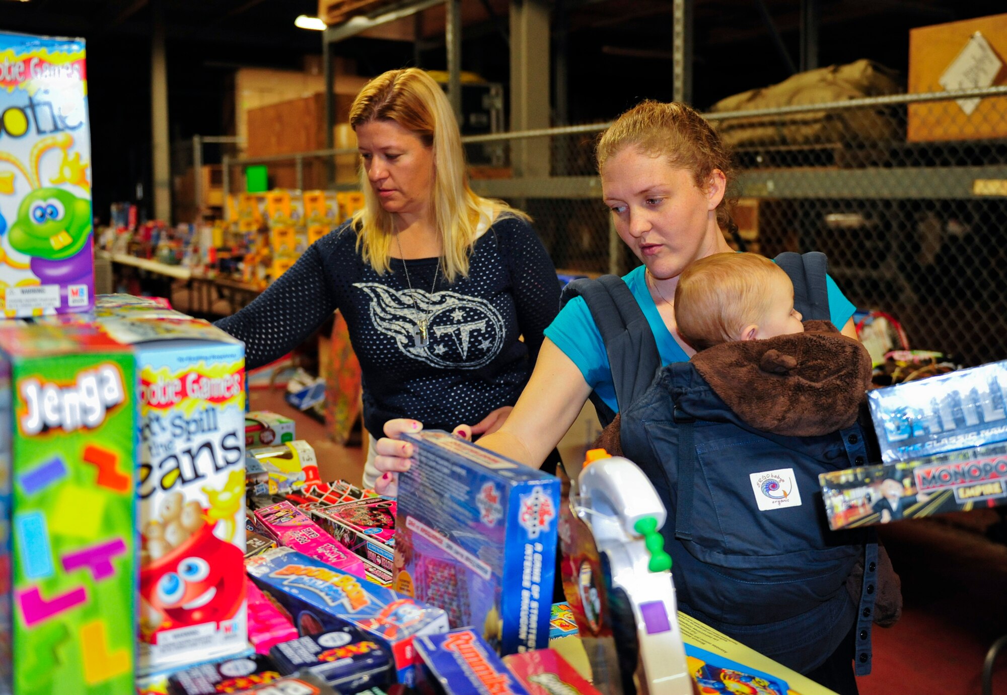Eglin families begin their holiday shopping with the help of the Airman’s Attic and Eglin’s First Sergeants Council during the 11th annual toy distribution at Eglin Air Force Base, Fla. Dec. 5. Approximately 2,000 toys were collected by donations made throughout the year. Toys, bikes, books, games, crafts, sports equipment and stuffed animals were given to active-military families in need of assistance during the holidays. (U.S. Air Force photo/Ilka Cole)