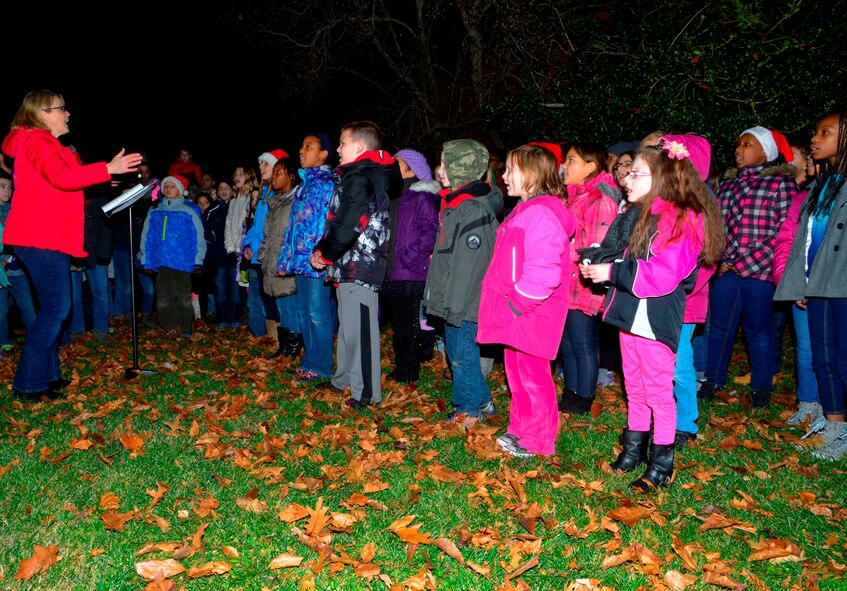 Welch Elementary School children sing Christmas songs during a tree lighting ceremony Dec. 4, 2014, at the base housing chapel on Dover Air Force Base, Del. After the tree was lit, children were able to meet and take photos with Santa Claus. (U.S. Air Force photo/Airman 1st Class William Johnson)