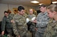 Cadets from the Air Force ROTC Detachment 875 at Virginia Tech recently visited Arnold Engineering Development Complex (AEDC), and while on base learned about the various test facilities and their capabilities. 1st Lt. Joseph Achenbach, pictured second from right, uses part of a model to explain how the high speed impact and ballistics facility, G-Range, works. (Photo by Rick Goodfriend)