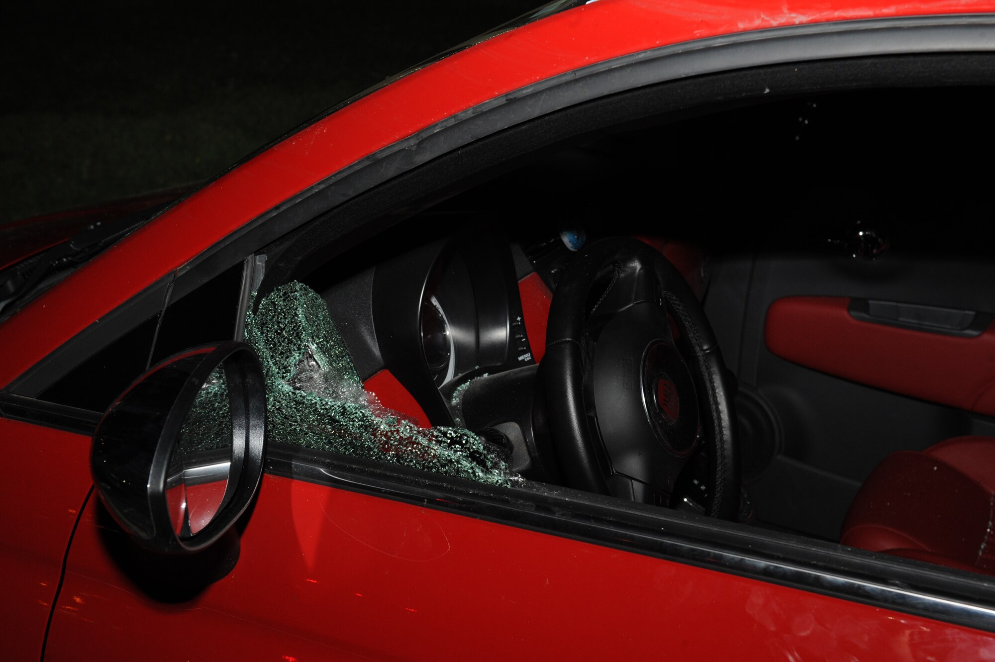 Staff Sgt. James Bryant III, 2nd Security Forces Squadron shift supervisor, broke the window of a vehicle to help an airman who was having a seizure at the entrance of Barksdale Air Force Base, La., June 2, 2014. His quick and decisive actions ensured the safety of the airman as well as other drivers on the busy street the vehicle was heading toward. (U.S. Air Force photo/Senior Airman Benjamin Gonsier)