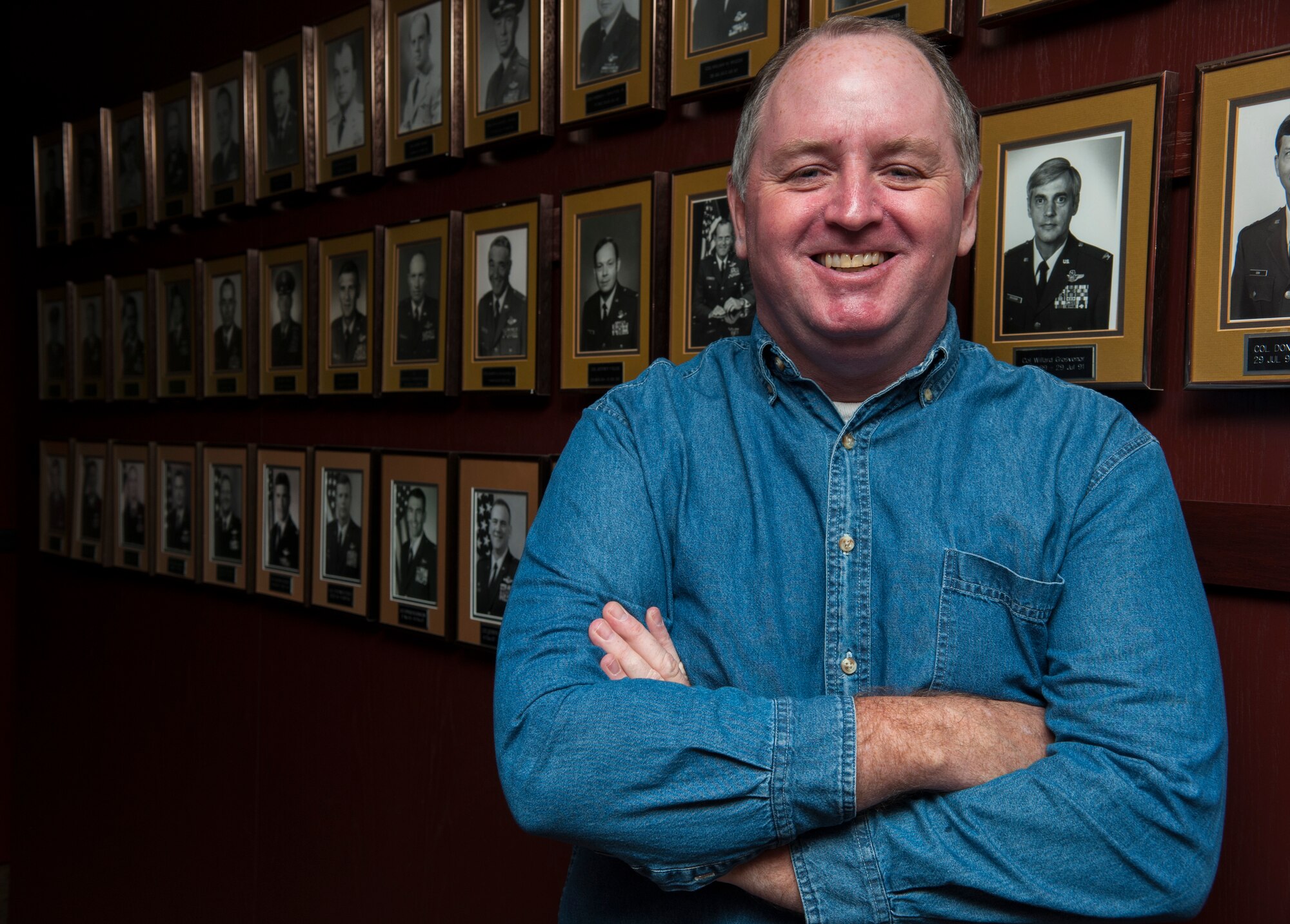 Casey Connell, 47th Flying Training Wing historian, poses for a photo at Laughlin Air Force Base, Texas, Dec. 4, 2014. As the wing historian, Connell is responsible for writing the wing’s yearly narrative, which is a comprehensive record of all the events that take place at the base over the course of a year. This record includes everything from the base’s organizational structure, mission, training, aircraft maintenance, safety issues, exercises and awards. (U.S. Air Force photo by Staff Sgt. Nathan Maysonet) (Released)