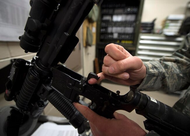 Staff Sgt. Jonathan Breed, 628th Security Forces Squadron Armory assistant NCOIC, inspects an M-4 carbine Dec. 3, 2014, at Joint Base Charleston, S.C. Armorers safe house firearms, ammunition, night vision goggles, and other tactical gear used by the 628th SFS. (U.S. Air Force photo/Senior Airman Jared Trimarchi) 