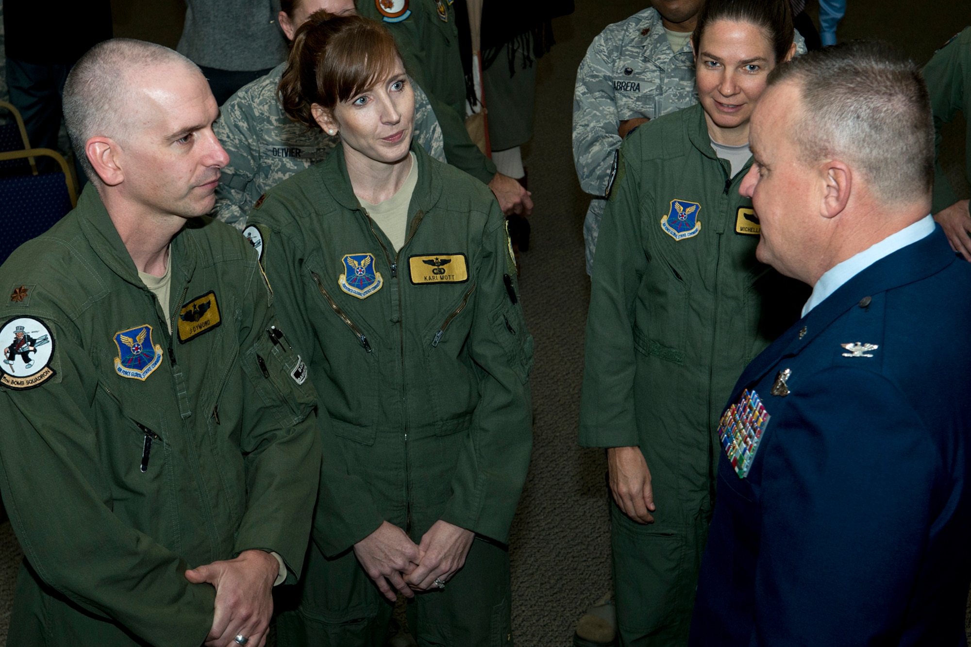 U.S. Air Force Col. Bruce Cox talks with members of the 11th Bomb Squadron following a 307th Bomb Wing Change of Command ceremony, Dec. 7, 2014, Barksdale Air Force Base, La. Cox is the former Director of Operations and Plans Directorate, 10th Air Force, and took command of the 307th Bomb Wing during the ceremony. (U.S. Air Force photo by Master Sgt. Greg Steele/Released)