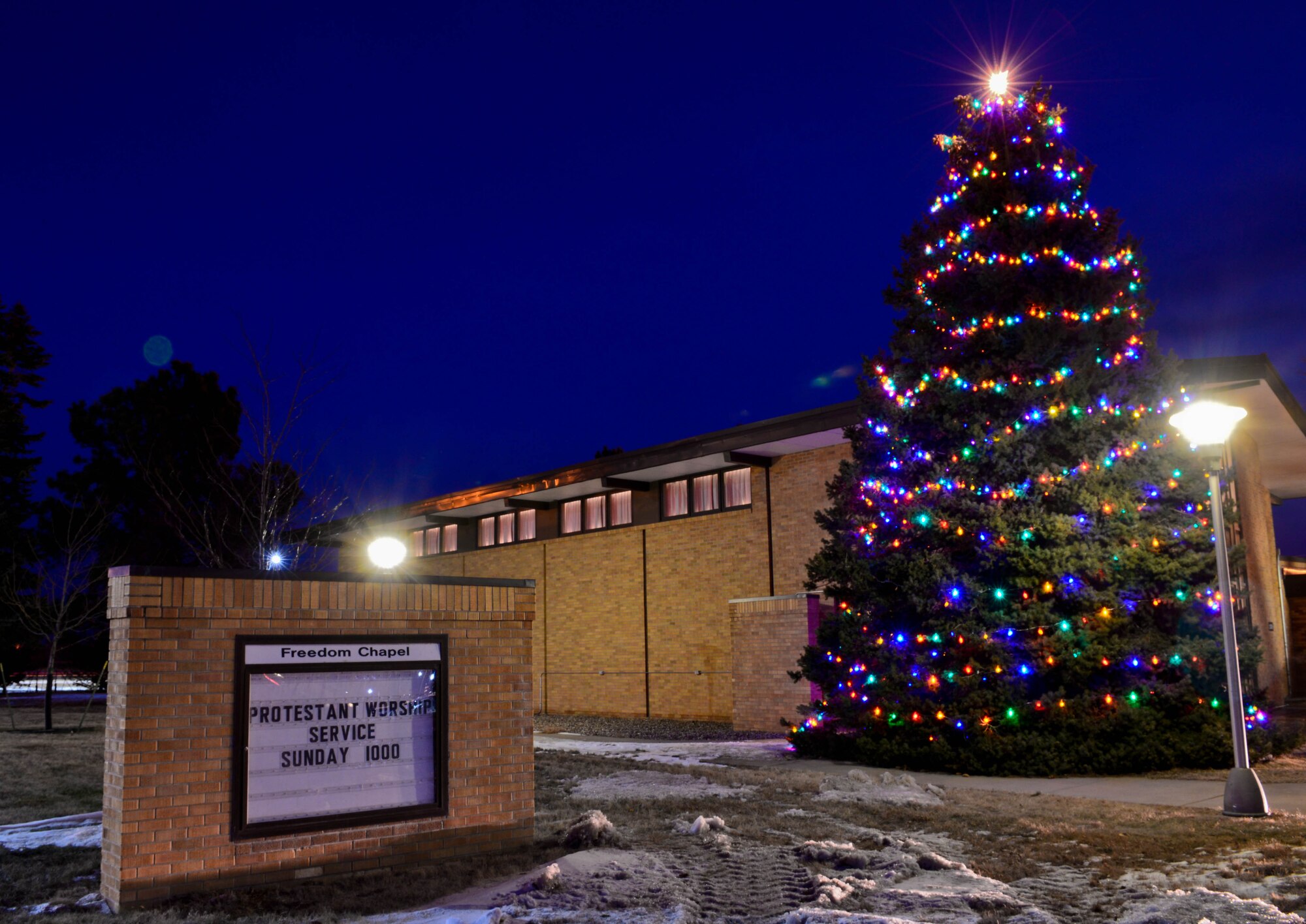 The base kicked off the Holiday season with the 28th Bomb Wing Tree Lighting Ceremony at the Freedom Chapel on Ellsworth Air Force Base, S.D., Dec. 3, 2014. The trees lights will shine throughout the holiday season. (U.S. Air Force photo by Senior Airman Zachary Hada/Released)
