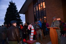 Capt. Thomas Foley, 28th Bomb Wing chaplain, welcomes Airmen and family members to the 28th BW Tree Lighting Ceremony at the Freedom Chapel on Ellsworth Air Force Base, S.D., Dec. 3, 2014. Col. Kevin Kennedy, 28th BW commander, kicked off the evening with a speech, a surprise visit from Santa Claus, holiday music, and holiday goodies for all who attended the ceremony. (U.S. Air Force photo by Senior Airman Zachary Hada/Released)