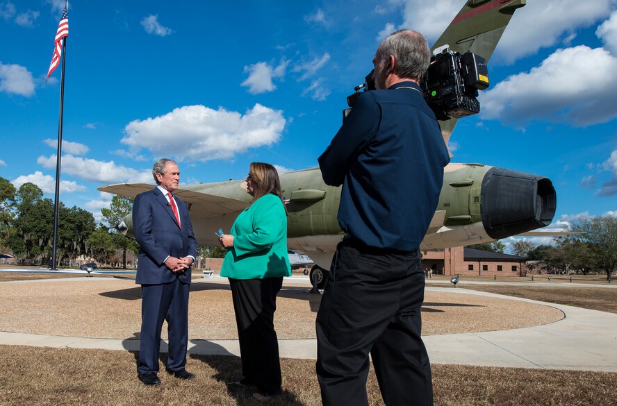The Honorable George W. Bush, 43rd President of the United States, conducts an interview with CNN reporter Candy Crowley in the President George W. Bush Air Park Dec. 4, 2014 at Moody Air Force Base, Ga. The air park was dedicated to Bush in May 2011 to honor the year he spent at Moody for pilot training.  (U.S. Air Force photo by Airman 1st Class Ceaira Tinsley/Released)