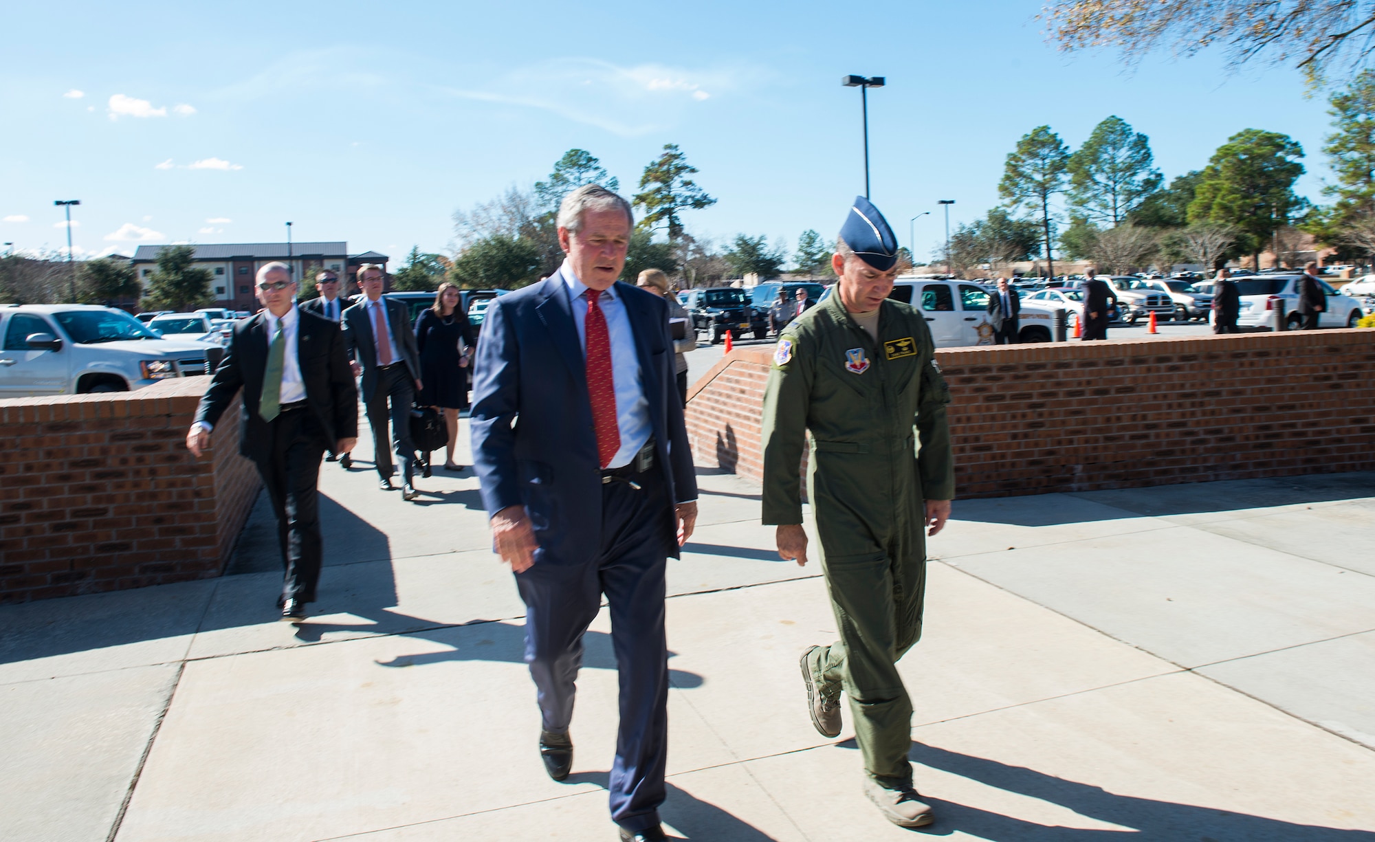 The Honorable George W. Bush, 43rd President of the United States and U.S. Air Force Col. Chad Franks, 23d Wing Commander, enter the Parker Greene Base Support Center Dec. 4, 2014, at Moody Air Force Base, Ga. Franks greeted Bush upon his arrival and welcomed him back to Moody after being away for nearly 45 years. The former president attended pilot training at Moody from 1968-1969.  (U.S. Air Force photo by Airman 1st Class Ceaira Tinsley/Released)