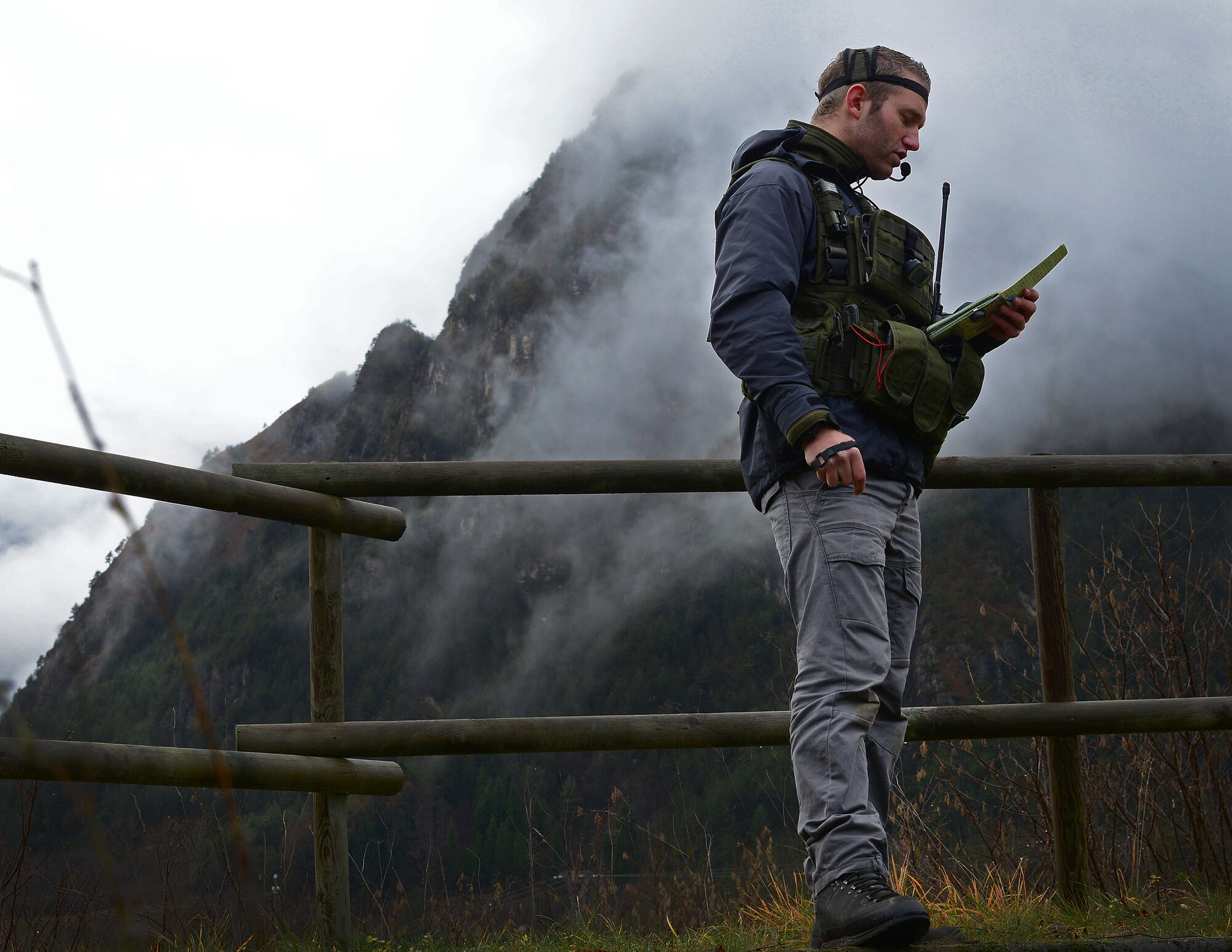 A Royal Netherlands army joint tactical air controller reads coordinates to an F-16 Fighting Falcon pilot, Dec. 4, 2014, in Barcis, Italy. During a week-long exercise, U.S. and Dutch JTACs trained with 555th Fighter Squadron pilots to stay current in their proficiencies. (U.S. Air Force photo/Senior Airman Matthew Lotz)