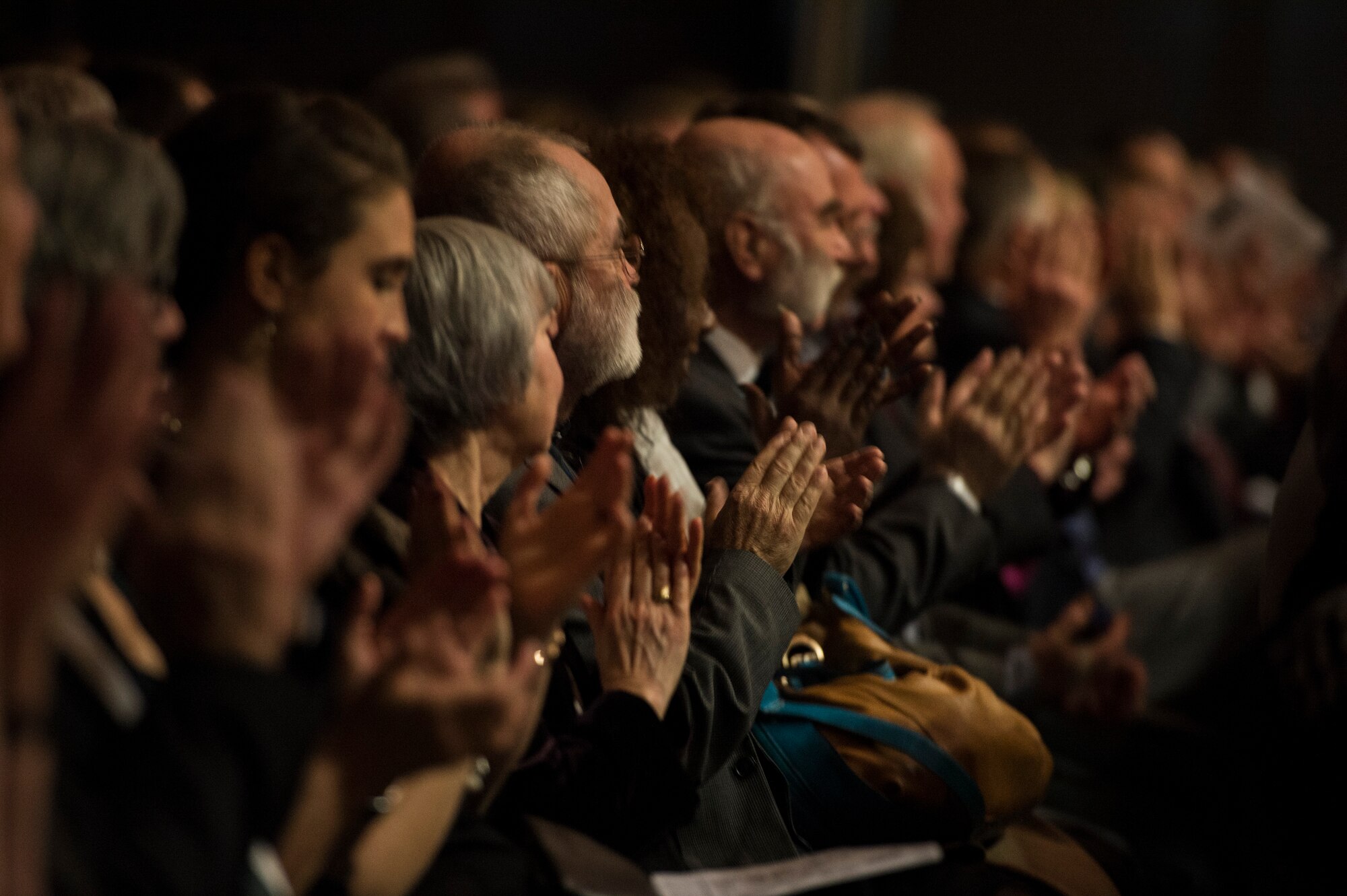 Audience members applaud at the end of a musical performance by the U.S. Air Forces in Europe Band during their holiday concert in Bitburg, Germany, Dec. 6, 2014. More than 300 local nationals attended the concert hosted by the USAFE band during their 50th anniversary performing their holiday concert series for the community of Bitburg. (U.S. Air Force photo by Staff Sgt. Christopher Ruano/Released)