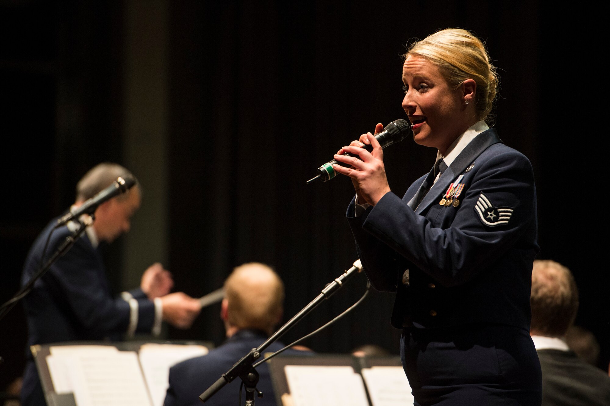 U.S. Air Force Staff Sgt. Jill Diem, U.S. Air Forces in Europe Band vocalist from Minneapolis, sings during a holiday concert in Bitburg, Germany, Dec. 6, 2014. The USAFE Band, stationed at Ramstein Air Base, Germany, holds their holiday series in a wide variety of venues across Europe. (U.S. Air Force photo by Staff Sgt. Christopher Ruano/Released)