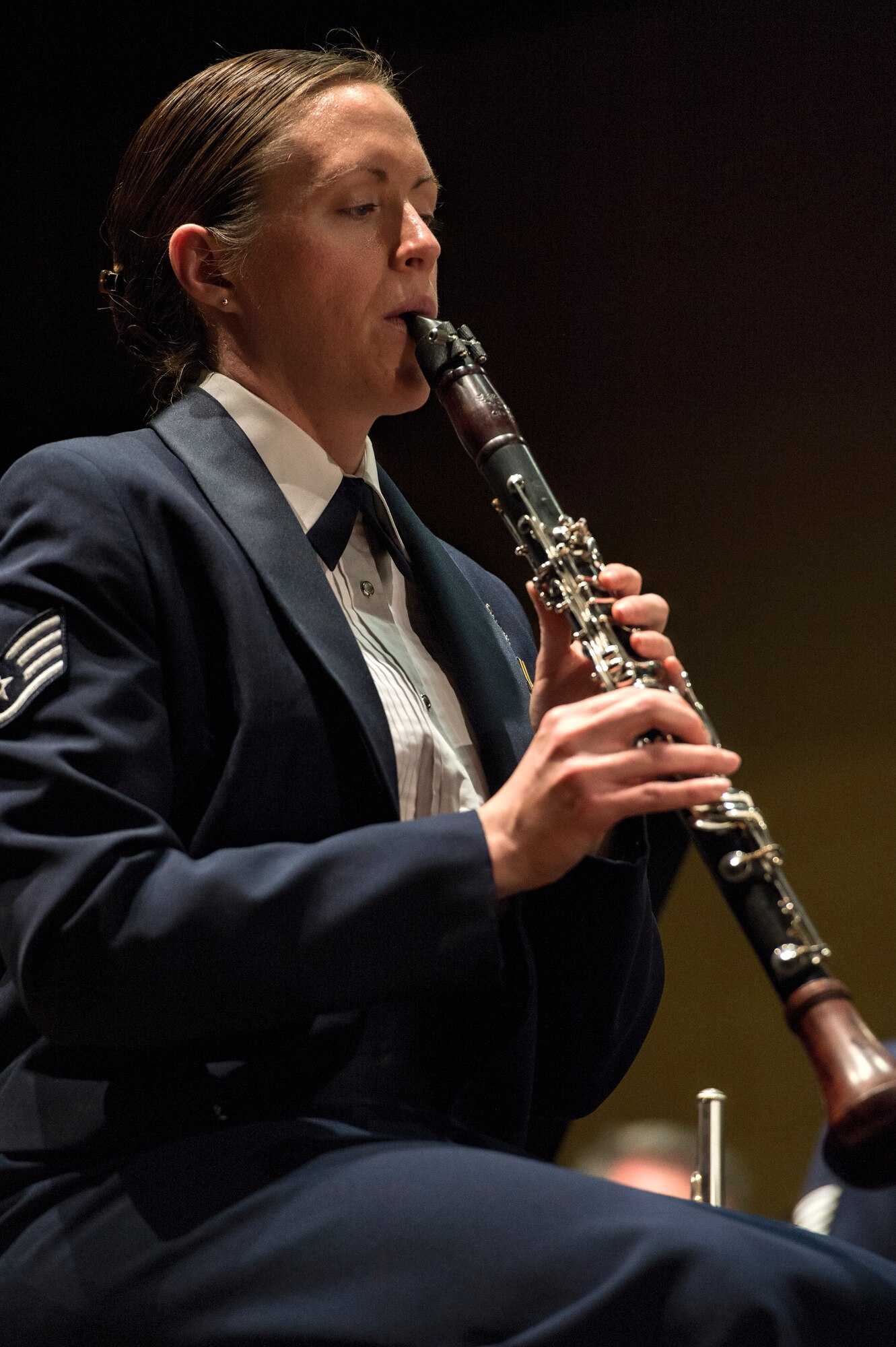U.S. Air Force Staff Sgt. Chantelle Friedman, U.S. Air Forces in Europe Band clarinetist from Ashland, N.H., plays the clarinet during a holiday concert in Bitburg, Germany, Dec. 6, 2014. Musical pieces played at the concert consisted of “Jingle Bells”, “Eternal Light”, “Sleigh Ride” and other holiday music from around the world. (U.S. Air Force photo by Staff Sgt. Christopher Ruano/Released)