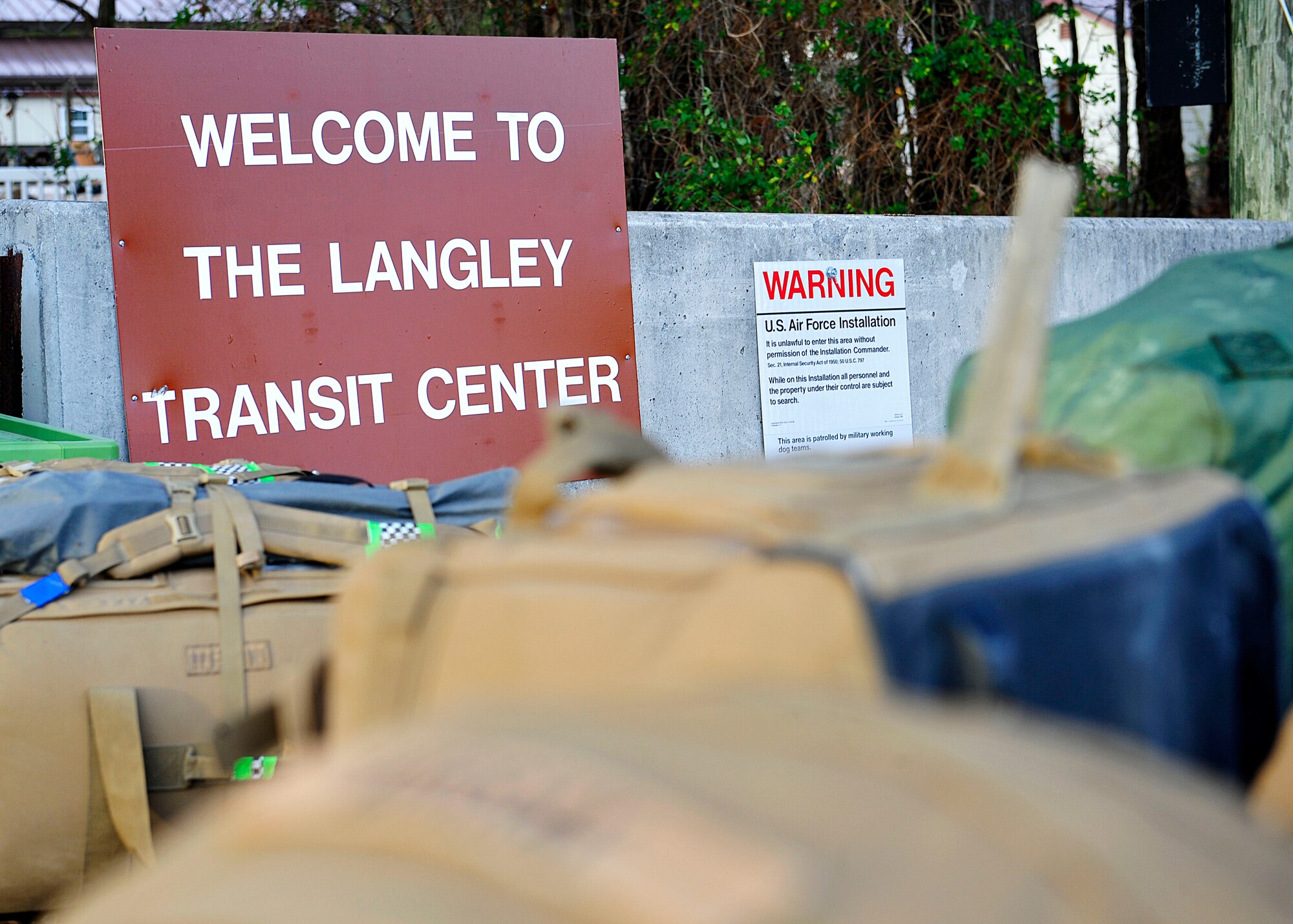 Duffel bags and suitcases sit outside the Langley Transit Center at Langley Air Force Base, Va., Dec. 4, 2014. Several Service members from multiple branches of the U.S. military underwent a 21-day controlled monitoring period at the transit center after returning from West Africa in support of Operation United Assistance. (U.S. Air Force photo by Airman 1st Class Breonna Veal/ Released)