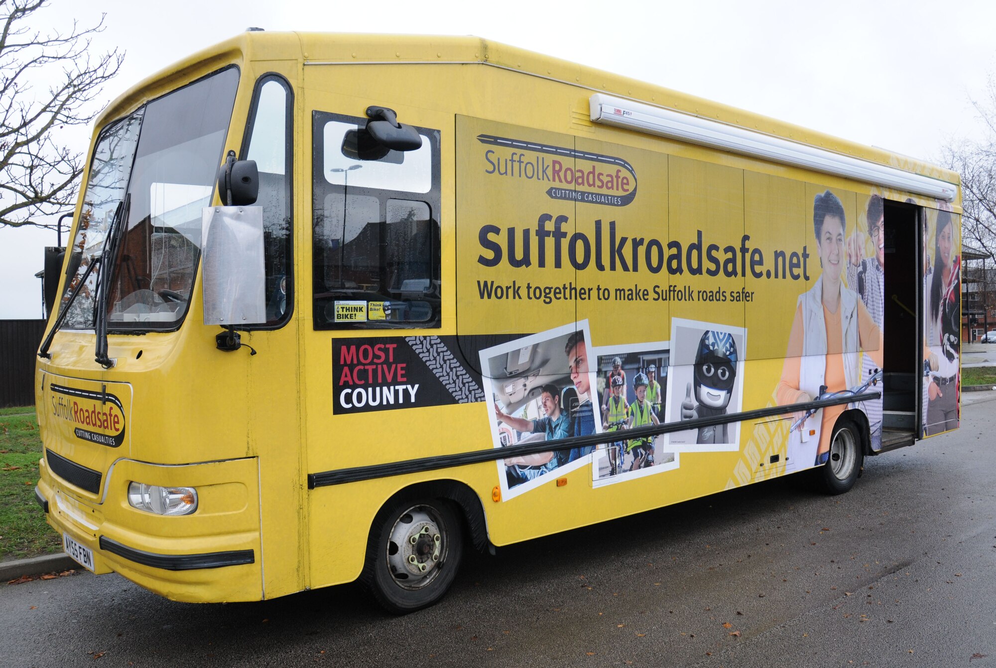 A Suffolk County Council Road Safety bus is displayed in the parking lot at the BXtra Dec. 2, 2014, on RAF Mildenhall, England. The 100th Air Refueling Wing Safety Office joined with Suffolk County Council Road Safety to educate base members on road dangers and test their reaction times using a Batak board. (U.S. Air Force photo by Gina Randall/Released)
