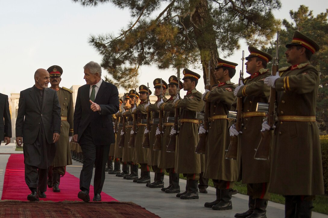 Afghan President Mohammad Ashraf Ghani welcomes Defense Secretary Chuck Hagel with an honor cordon at the presidential palace in Kabul, Afghanistan, Dec. 6, 2014. DoD photo by Air Force Master Sgt. Adrian Cadiz