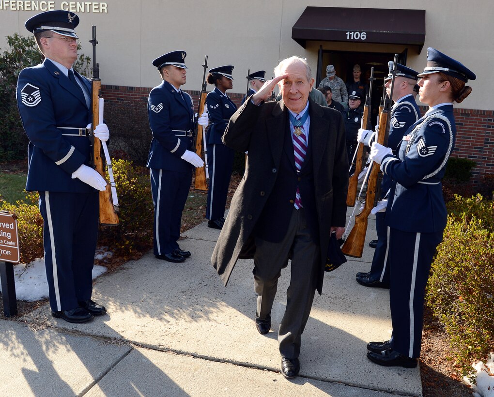 Medal of Honor recipient retired Navy Capt.Thomas Hudner Jr. returns the salute of the Hanscom Air Force Base Patriot Honor Guard, as he leaves a ceremony in his honor on Hanscom Air Force Base, Mass., Dec. 4, 2014. 