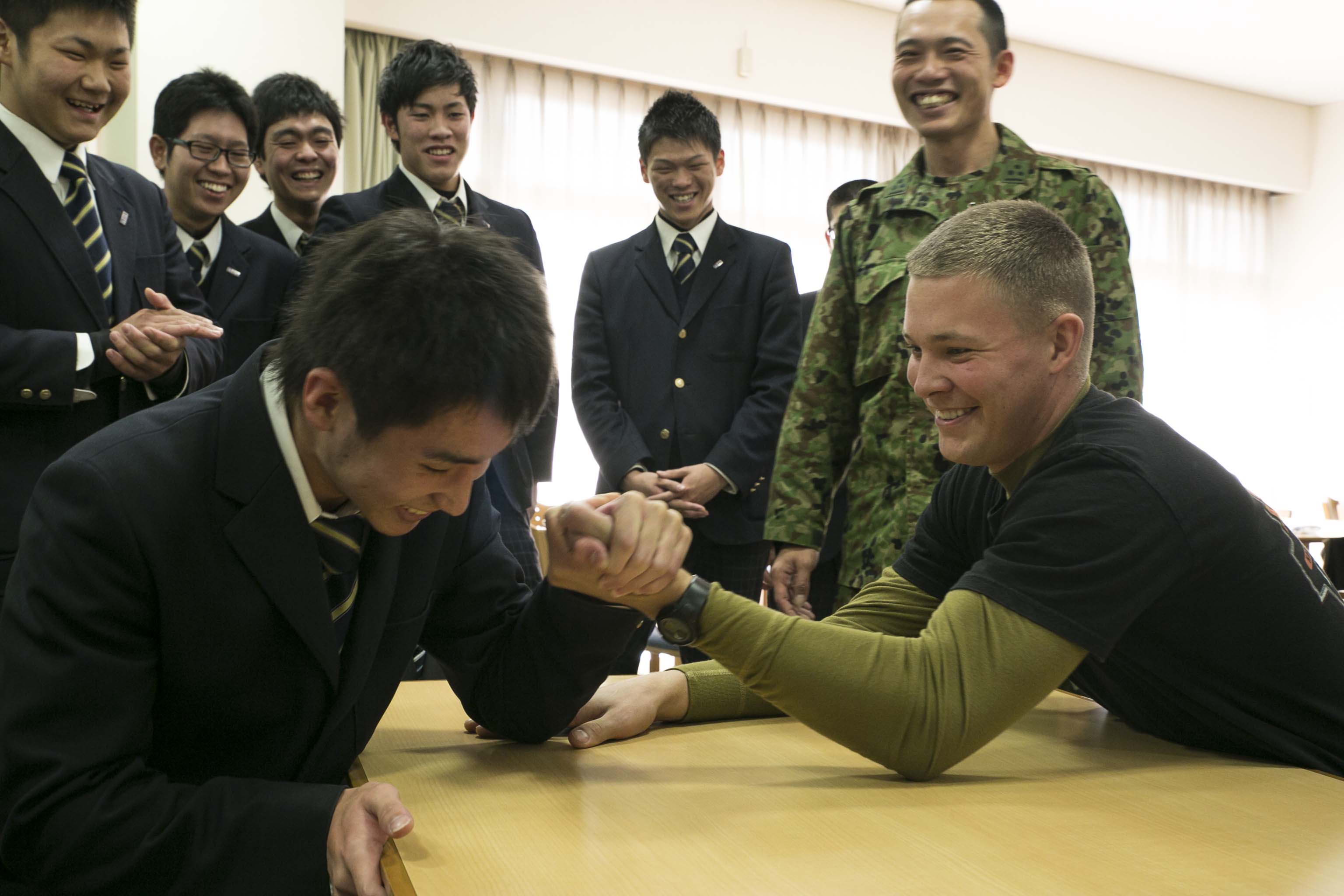 Image result for friendly arm wrestling match