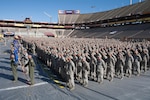 Arizona National Guard Soldiers from the 158th Maneuver Enhancement Brigade stand in formation on the field at Arizona State University’s Sun Devil Stadium, Dec. 7, 2014 in Tempe.  The formation, which was part of the Arizona National Guard Muster and Community Expo, was the first time in over a century Arizona Soldiers and Airmen assembled together in mass formation.