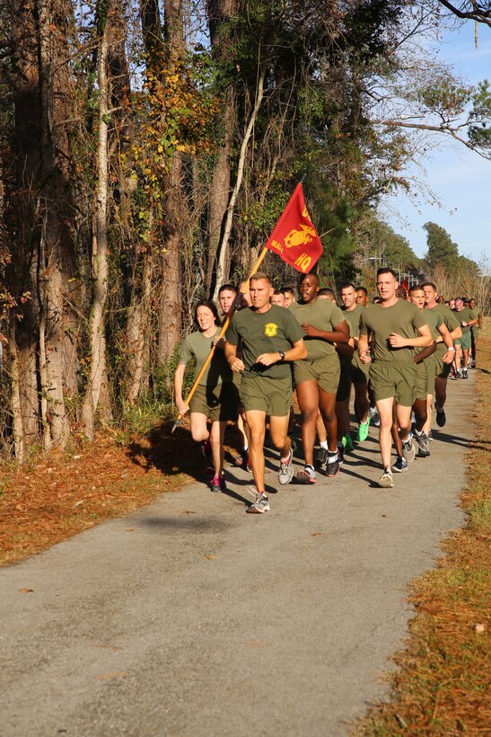 Lt. Col. Bryan T. Horvarth leads the Marines of Marine Aviation Logistics Squadron 14 during a motivational run at Marine Corps Air Station Cherry Point, N.C., Dec 3, 2014. Horavarth is the commanding officer of the squadron.