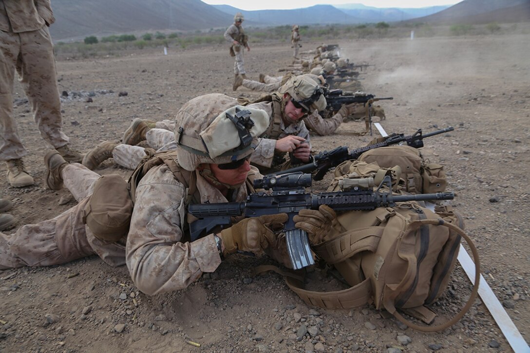 Marines with Golf Company, Battalion Landing Team 2nd Battalion, 1st Marines, 11th Marine Expeditionary Unit (MEU), battle zero their weapons at a live-fire range during sustainment training in D'Arta Plage, Djibouti, Dec. 4. The Makin Island Amphibious Ready Group (ARG), and the embarked 11th MEU provide a versatile, sea-based, expeditionary force that can be tailored to a variety of missions in the U.S. 5th Fleet area of responsibility. (U.S. Marine Corps photo by Cpl. Laura Y. Raga/Released)