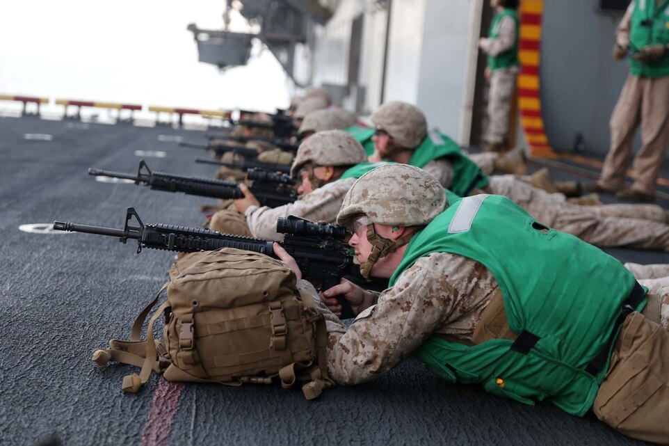 Marines with Combat Logistics Battalion 11, 11th Marine Expeditionary Unit (MEU), participate in a live-fire range aboard the amphibious assault ship USS Makin Island (LHD 8), Dec 5. The Makin Island Amphibious Ready Group (ARG) and the embarked 11th MEU are deployed in support of maritime security operations and theater security cooperation efforts in the U.S. 5th Fleet area of responsibility. (U.S. Marine Corps photos by Cpl. Demetrius Morgan/Released)