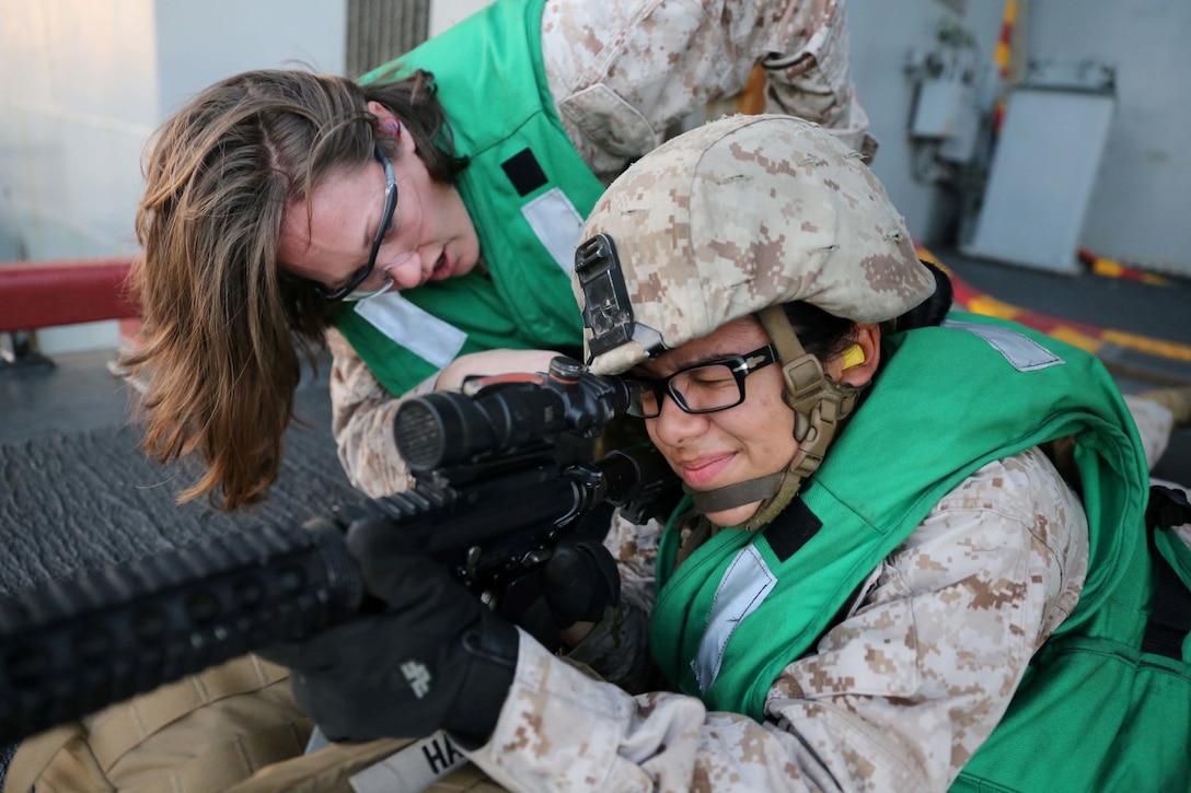 Cpl. Corina Nunez, a motor transport Marine with Combat Logistics Battalion 11, 11th Marine Expeditionary Unit (MEU), participates in a live-fire exercise aboard the amphibious assault ship USS Makin Island (LHD 8), Dec. 5. The Makin Island Amphibious Ready Group (ARG) and the embarked 11th Marine Expeditionary Unit are deployed in support of maritime security operations and theater security cooperation efforts in the U.S. 5th Fleet area of responsibility. (U.S. Marine Corps photos by Cpl. Demetrius Morgan/Released)