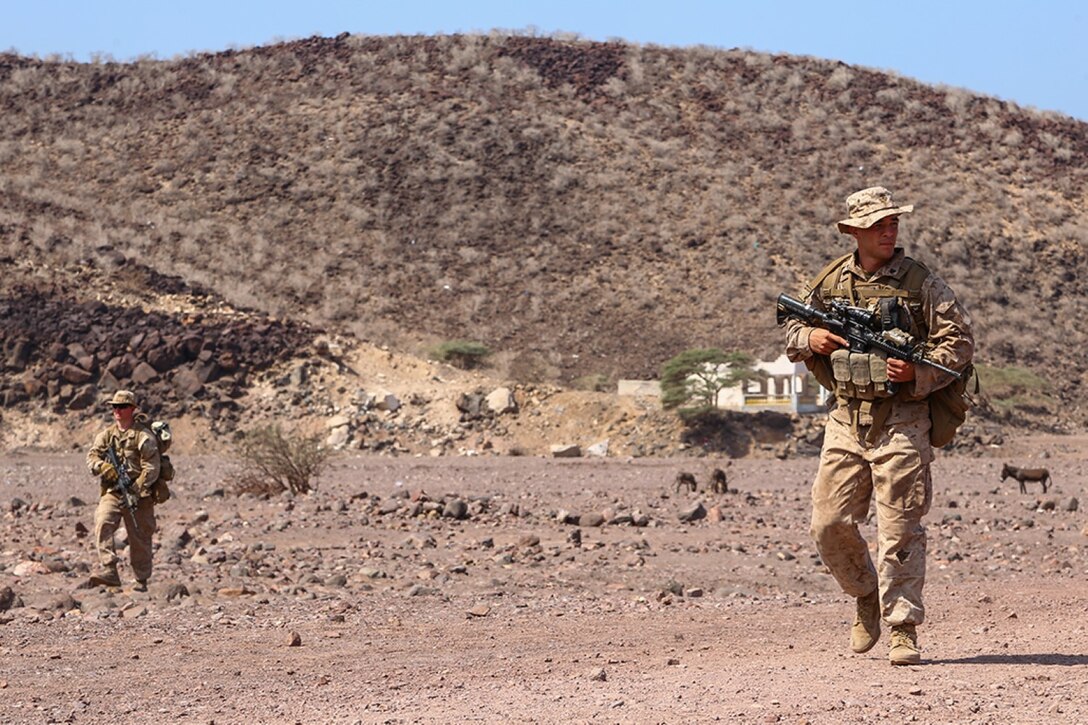 Cpl. Robert Gomez, an assault squad leader with Golf Company, Battalion Landing Team 2nd Battalion, 1st Marines, 11th Marine Expeditionary Unit (MEU), and Fenton, Michigan native, patrols with his squad during sustainment training in D'Arta Plage, Djibouti, Dec. 6. The Makin Island Amphibious Ready Group (ARG) and the embarked 11th MEU provide a versatile, sea-based, expeditionary force that can be tailored to a variety of missions in the U.S. 5th Fleet area of responsibility. (U.S. Marine Corps photo by Cpl. Laura Y. Raga/Released)