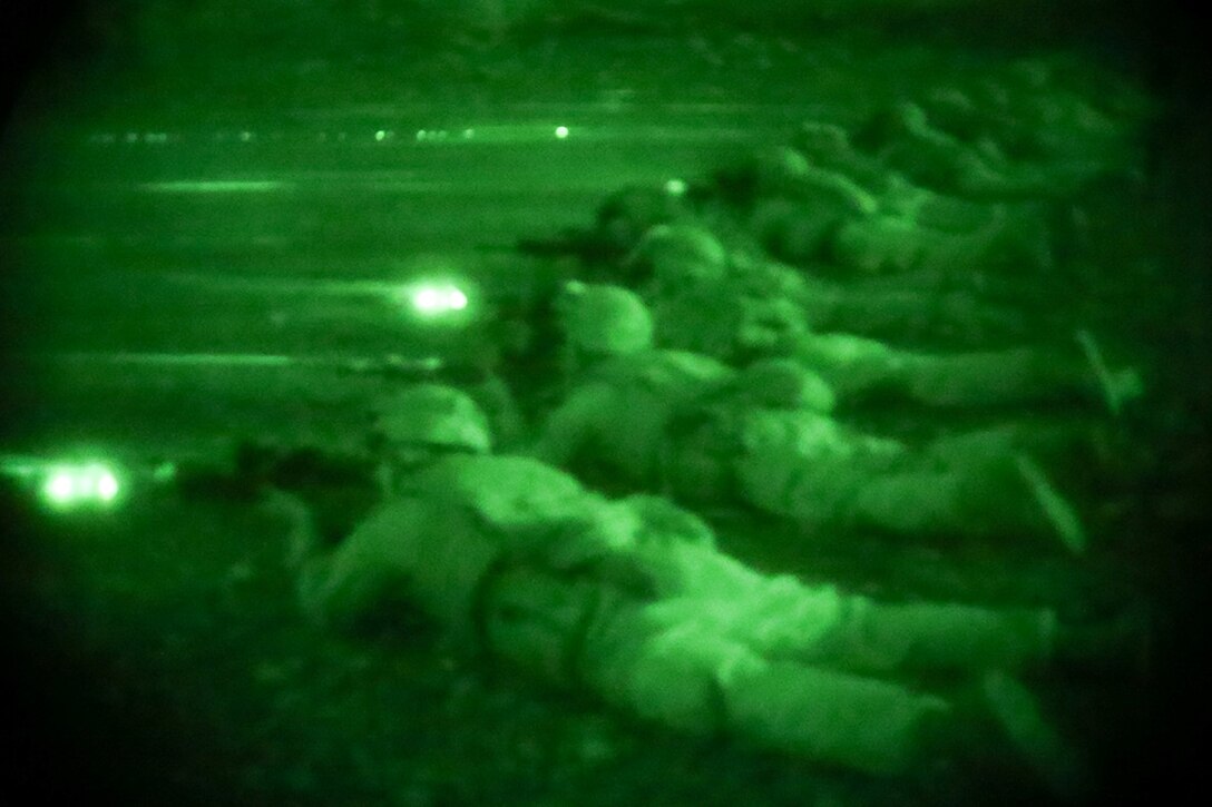 Marines with Golf Company, Battalion Landing Team 2nd Battalion, 1st Marines, 11th Marine Expeditionary Unit (MEU), conduct a night live-fire range during sustainment training in D'Arta Plage, Djibouti, Dec. 6. The Makin Island Amphibious Ready Group (ARG) and the embarked 11th MEU provide a versatile, sea-based, expeditionary force that can be tailored to a variety of missions in the U.S. 5th Fleet area of responsibility. (U.S. Marine Corps photo by Cpl. Laura Y. Raga/Released)  