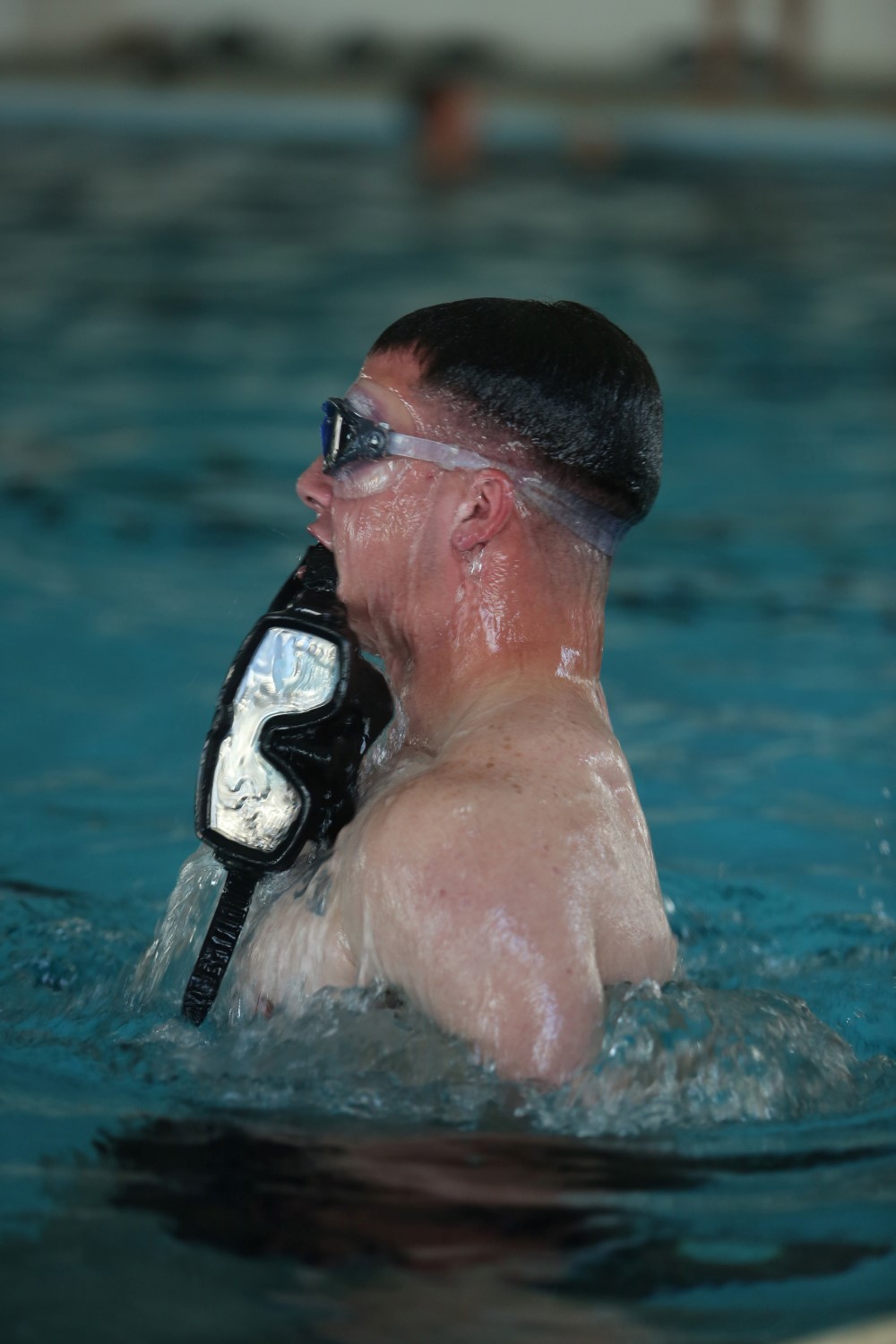 A Marine with the reconnaissance detachment, 11th Marine Expeditionary Unit (MEU), practices bobs while holding goggles in his mouth in preparation for combatant diver school, Nov. 30, 2014. The 11th MEU is deployed with the Makin Island Amphibious Ready Group as a theater reserve and crisis response force throughout U.S. Central Command and the U.S. 5th Fleet area of responsibility. (U.S. Marine Corps photo by Cpl. Evan R. White/ Released)