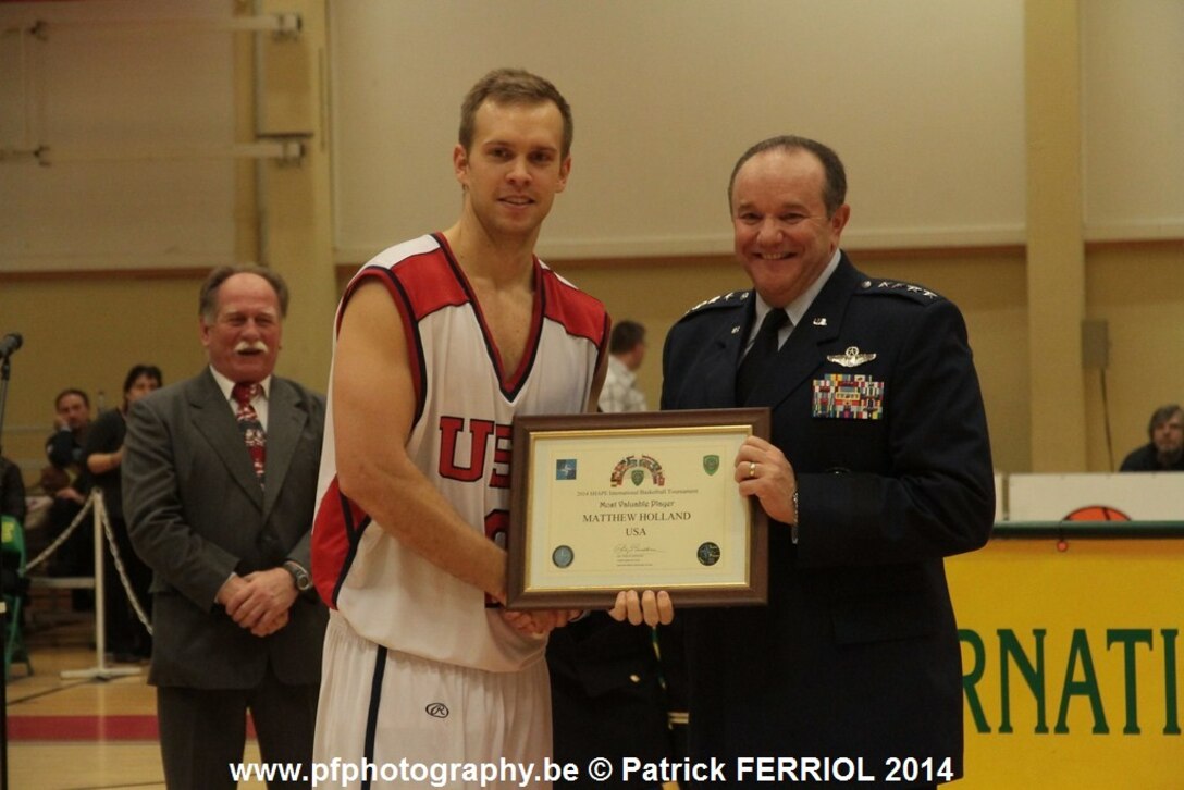 Air Force Capt. Matt Holland of Hanscom Air Force Base, Mass., here with Supreme Allied Commander Gen. Philip Breedlove, was named the tournament MVP. The U.S. Armed Forces men defeated Lithuania 87-82 to win the SHAPE International Basketball Championship for the first time since 2010.
