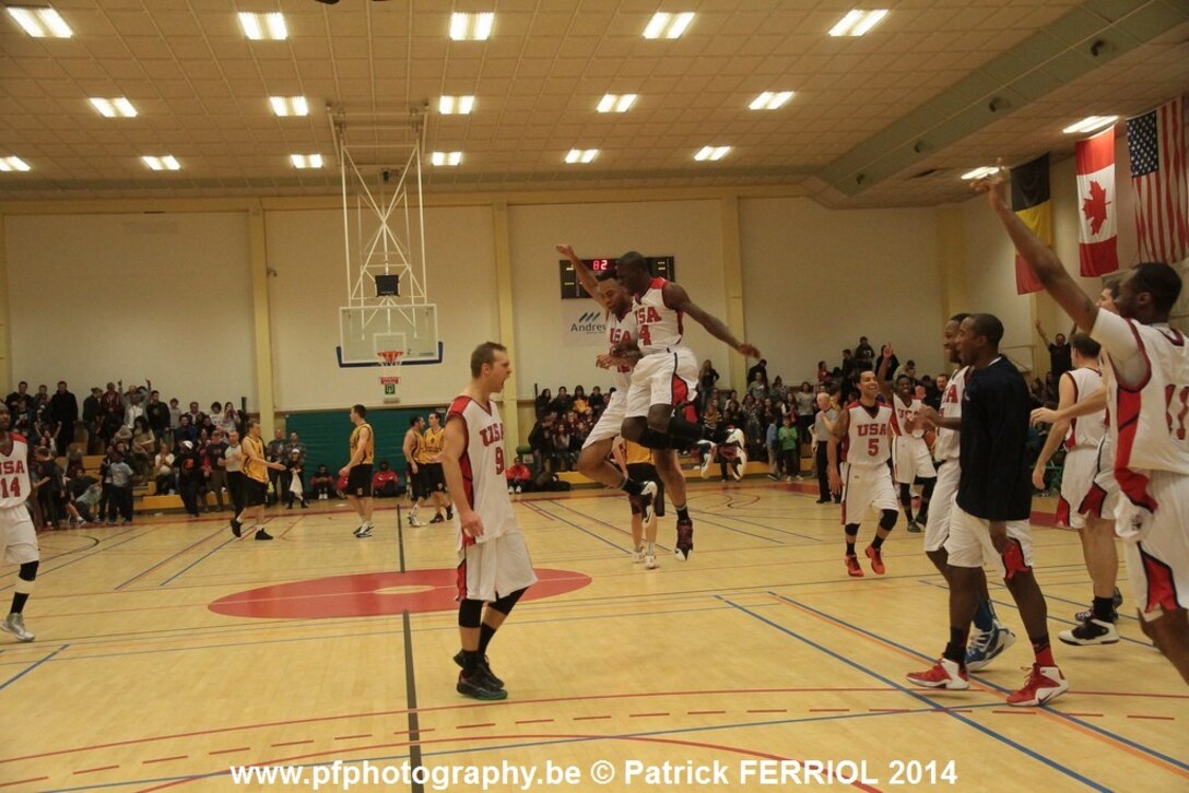 U.S. Armed Forces Men's Basketball team celebrates at the buzzer after defeating Lithuania 87-82 to win the 2014 SHAPE International Basketball Championship