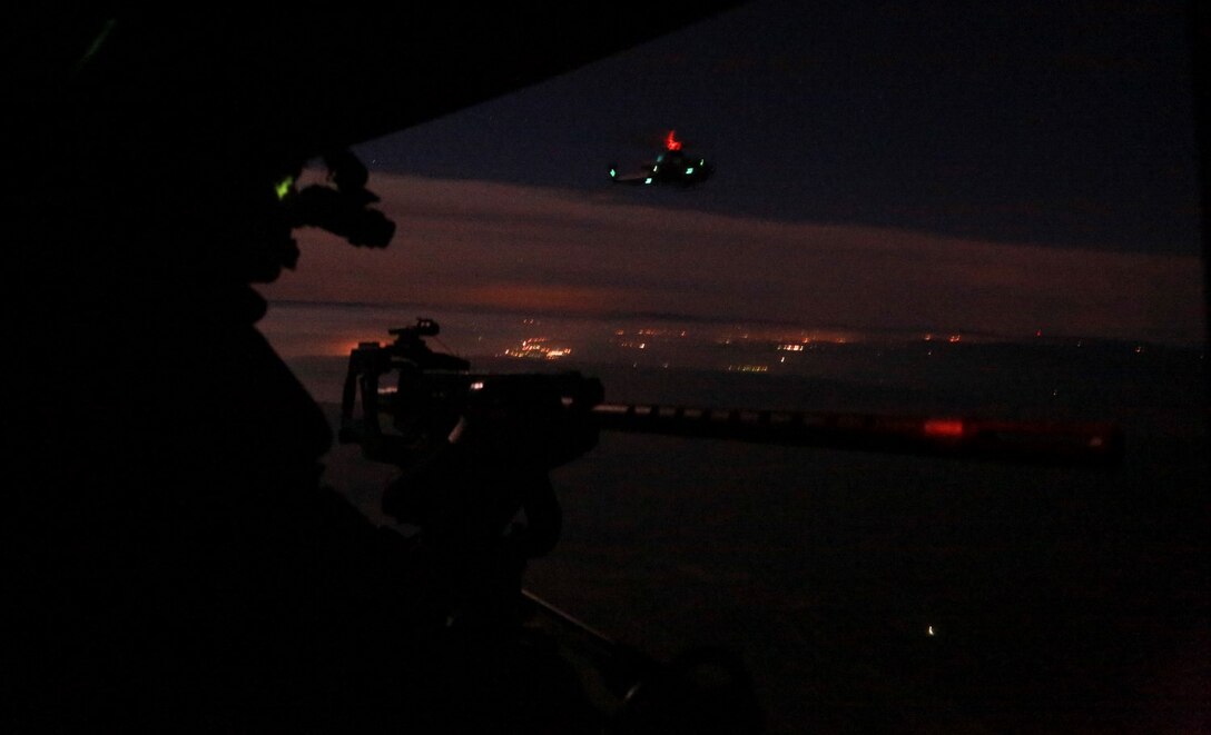 A U.S. Marine with Marine Medium Tiltrotor Squadron 161 (Reinforced), 15th Marine Expeditionary Unit, provides security during a tactical recovery of aircraft and personnel mission during realistic urban training aboard Camp Roberts, Calif., Dec. 7, 2014.  RUT prepares the 15th MEU's Marines for their upcoming deployment, enhancing their combat skills in environments similar to those they may find in future missions. (U.S. Marine Corps Photo by Cpl. Steve H. Lopez/Released)