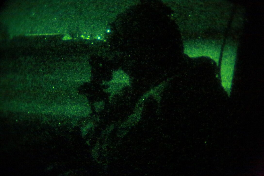 A U.S. Marine with Marine Medium Tiltrotor Squadron 161 (Reinforced), 15th Marine Expeditionary Unit, provides security during a tactical recovery of aircraft and personnel mission during realistic urban training aboard Camp Roberts, Calif., Dec. 7, 2014.  RUT prepares the 15th MEU's Marines for their upcoming deployment, enhancing their combat skills in environments similar to those they may find in future missions. (U.S. Marine Corps Photo by Gunnery Sgt. Eddy Arce/Released)