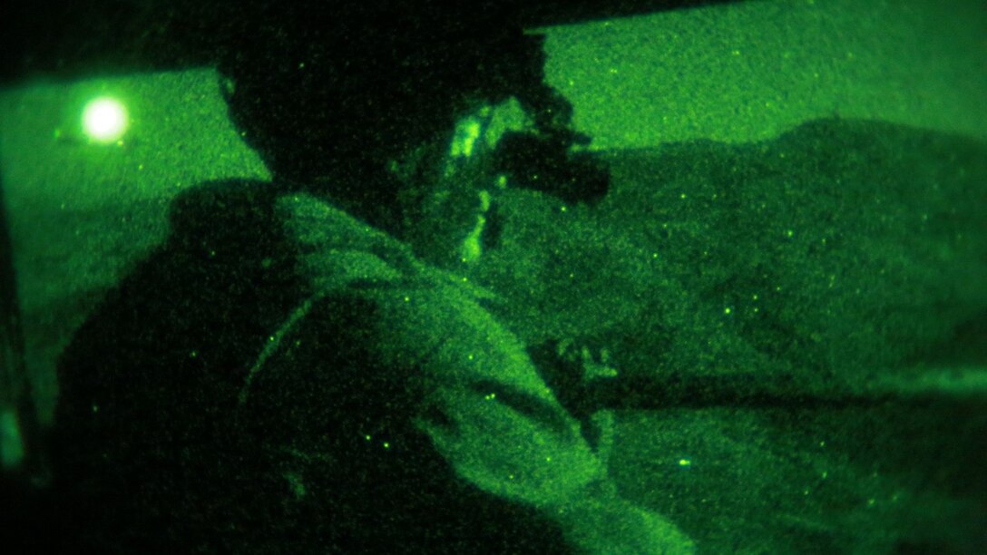 A U.S. Marine with Marine Medium Tiltrotor Squadron 161 (Reinforced), 15th Marine Expeditionary Unit, provides security during a tactical recovery of aircraft and personnel mission during realistic urban training aboard Camp Roberts, Calif., Dec. 7, 2014.  RUT prepares the 15th MEU's Marines for their upcoming deployment, enhancing their combat skills in environments similar to those they may find in future missions. (U.S. Marine Corps Photo by Gunnery Sgt. Eddy Arce/Released)