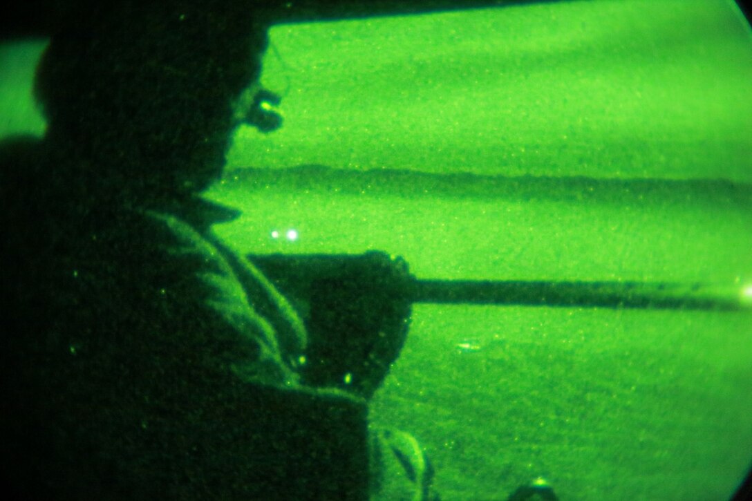 A U.S. Marine with Marine Medium Tiltrotor Squadron 161 (Reinforced), 15th Marine Expeditionary Unit, provides security during a tactical recovery of aircraft and personnel mission during realistic urban training aboard Camp Roberts, Calif., Dec. 7, 2014.  RUT prepares the 15th MEU's Marines for their upcoming deployment, enhancing their combat skills in environments similar to those they may find in future missions. (U.S. Marine Corps Photo by Gunnery Sgt. Eddy Arce/Released)