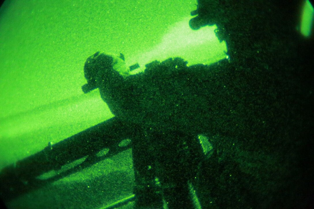 A U.S. Marine with Marine Medium Tiltrotor Squadron 161 (Reinforced), 15th Marine Expeditionary Unit, provides security during a tactical recovery of aircraft and personnel mission during realistic urban training aboard Camp Roberts, Calif., Dec. 7, 2014.  RUT prepares the 15th MEU's Marines for their upcoming deployment, enhancing their combat skills in environments similar to those they may find in future missions. (U.S. Marine Corps Photo by Gunnery Sgt. Eddy Arce/Released)