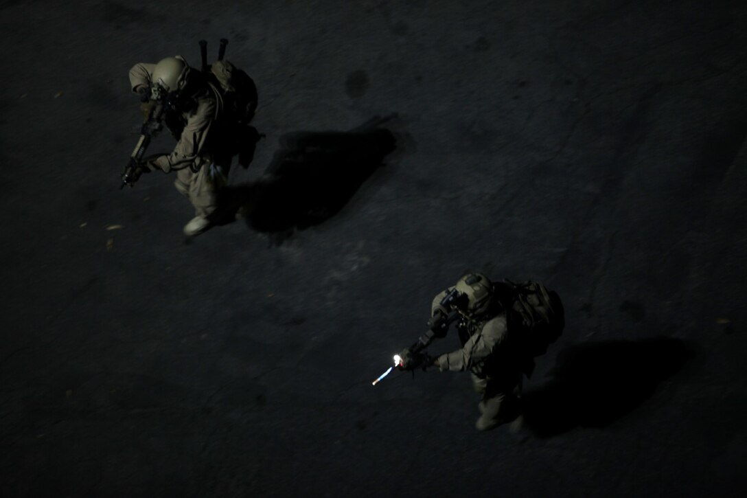 U.S. Marines with the 15th Marine Expeditionary Unit’s Maritime Raid Force approach a breaching point at Dodger Stadium during realistic urban training in Los Angeles Dec. 8, 2014. RUT prepares the 15th MEU Marines for their upcoming deployment, enhancing their combat skills in environments similar to those they may find in future missions. (U.S. Marine Corps photo by Staff Sgt. Miguel Carrasco/Released)