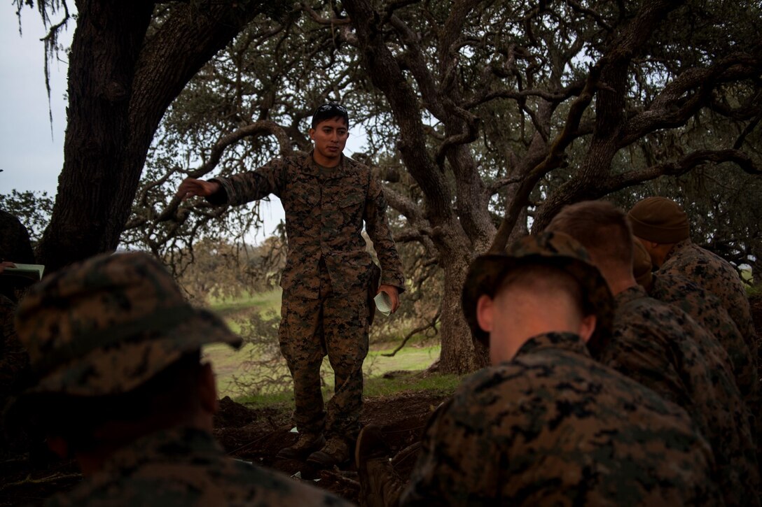 U.S. Marine Sgt. Steve De Leon gives a class about observation techniques to Marines with Lima Company, 3rd Battalion, 1st Marine Regiment, 15th Marine Expeditionary Unit, during the MEU’s realistic urban training exercise aboard Camp Roberts, Calif., Dec. 8, 2014. RUT prepares the 15th MEU Marines for their upcoming deployment, enhancing their combat skills in environments similar to those they may find in future missions. (U.S. Marine Corps photo by Cpl. Elize McKelvey/Released)