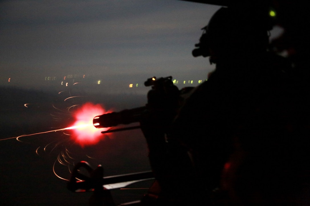 A U.S. Marine with Marine Medium Tiltrotor Squadron 161 (Reinforced), 15th Marine Expeditionary Unit, provides security during a tactical recovery of aircraft and personnel mission during realistic urban training aboard Camp Roberts, Calif., Dec. 7, 2014. RUT prepares the 15th MEU's Marines for their upcoming deployment, enhancing their combat skills in environments similar to those they may find in future missions. (U.S. Marine Corps Photo by Cpl. Steve H. Lopez/Released)