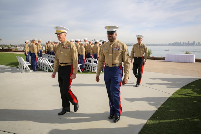 (from left to right) General Joseph F. Dunford, 36th Commandant of the Marine Corps, Sgt. Maj. Michael A. Logan, sergeant major, Marine Corps Recruiting Command, and Maj. Gen. Mark A. Brilakis, commanding general, Marine Corps Recruiting Command, exit the Superior Achiever Award Ceremony at the Admiral Kidd Conference Center, Naval Base Point Loma, San Diego, Dec. 5.  After the ceremony, the commandant spoke to the Marines about his vision and direction of the Marine Corps and addressed questions from them.