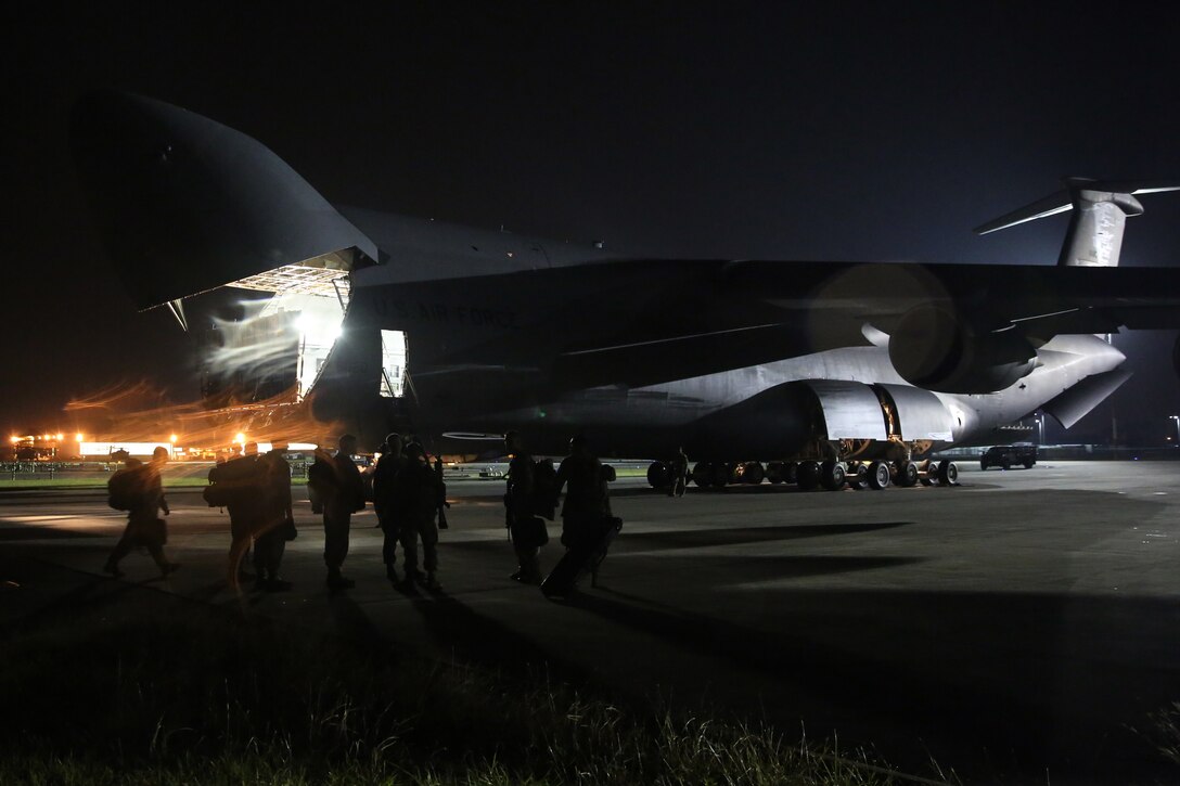 The final nine Marines representing the 2nd Marine Aircraft Wing’s involvement in Afghanistan walk down the flight line at Marine Corps Air Station Cherry Point, N.C., Dec. 6, 2014. The Marines belong to Marine Light Attack Helicopter Squadron 467 stationed at Marine Corps Air Station New River, N.C., and served more than seven months in Afghanistan.