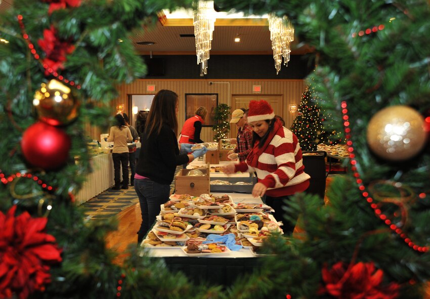 Volunteers gather at the Misawa Officers' Club to prepare cookie trays for over 2,700 unaccompanied service members at Misawa Air Base, Japan, Dec. 10, 2014. The Cookie Caper at Misawa is an annual event that involves volunteers from every branch of service represented at Misawa AB. (U.S. Air Force photo by Senior Airman Jose L. Hernandez-Domitilo/Released)
