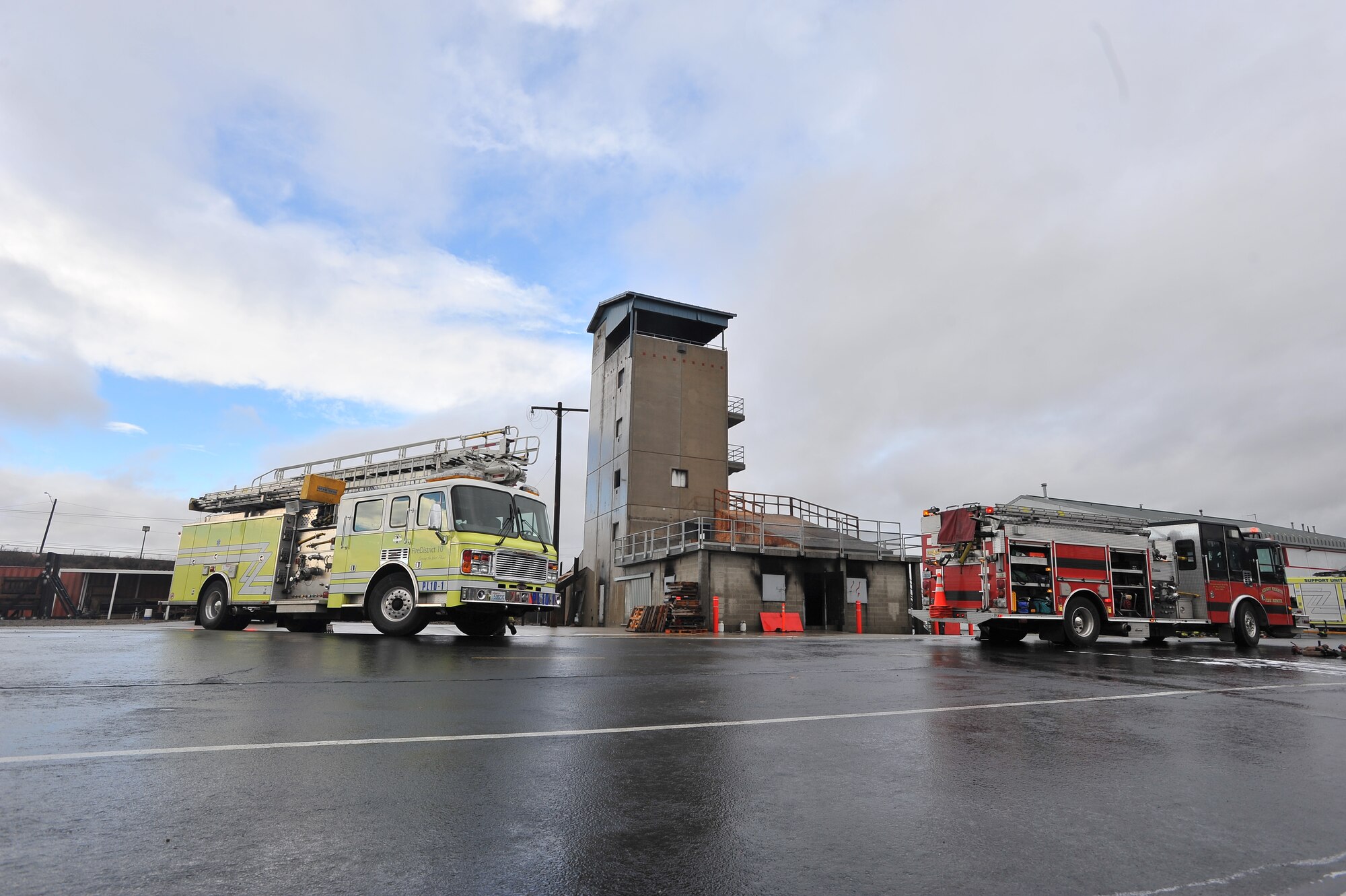 Fire engines from District 10, Medical lake and Airway Heights stations line up prior to a multi-company training drill Dec. 6, 2014, in Spokane Valley, Wash. Both Fairchild Airmen and local community members are currently in the West Plains Fire Academy course and will graduate at the end of December with a Fire Fighter One national certification. (U.S. Air Force photo/Staff Sgt. Veronica Montes)