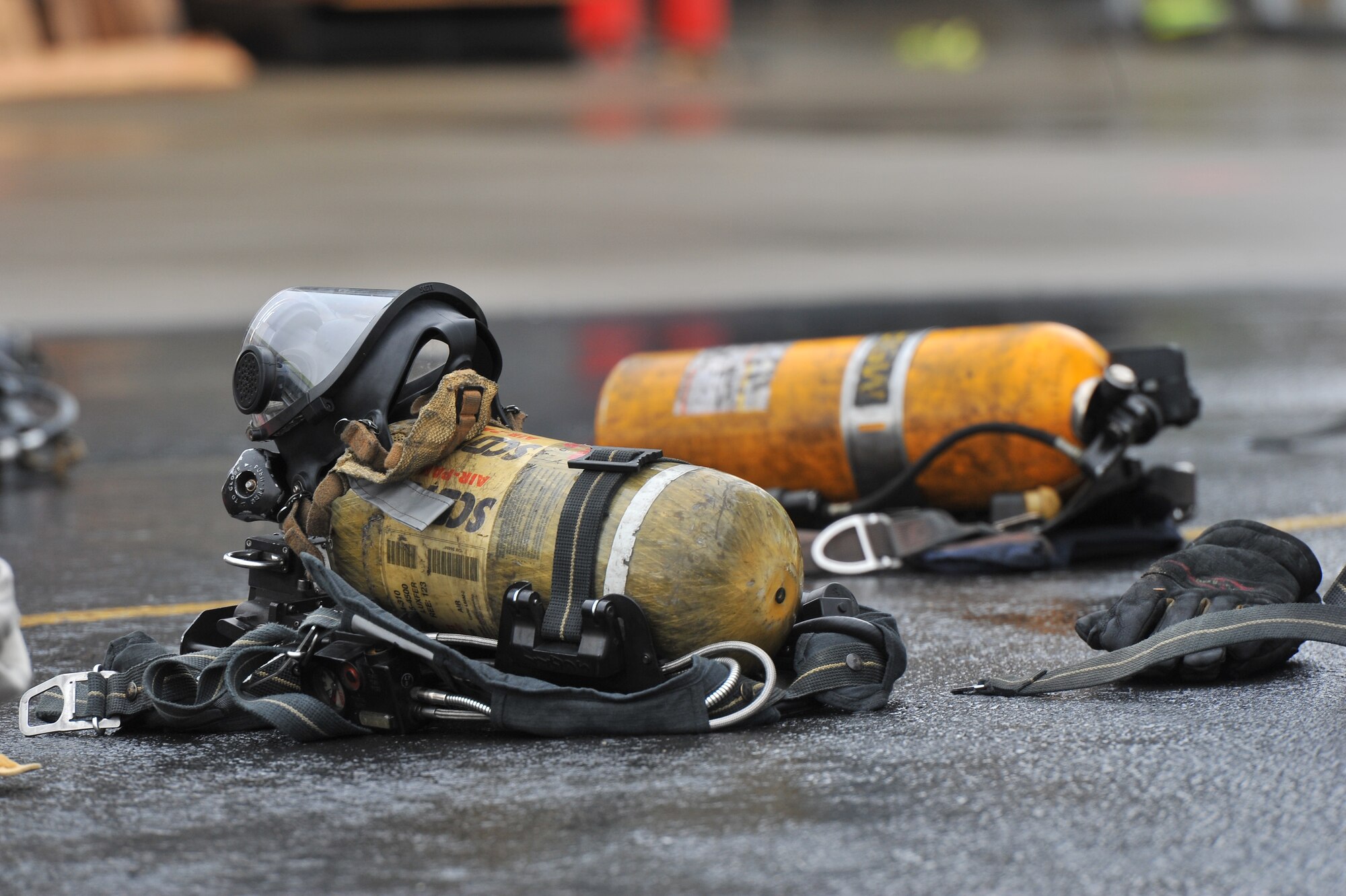 Firefighting equipment sits on the concrete prior to a multi-company training drill Dec. 6, 2014, in Spokane Valley, Wash. The training was conducted as part of a four month curriculum conducted by the West Plains Fire Academy.  Both Fairchild Airmen and local community members are currently in the course and will graduate at the end of December with a Fire Fighter One national certification. (U.S. Air Force photo/Staff Sgt. Veronica Montes)