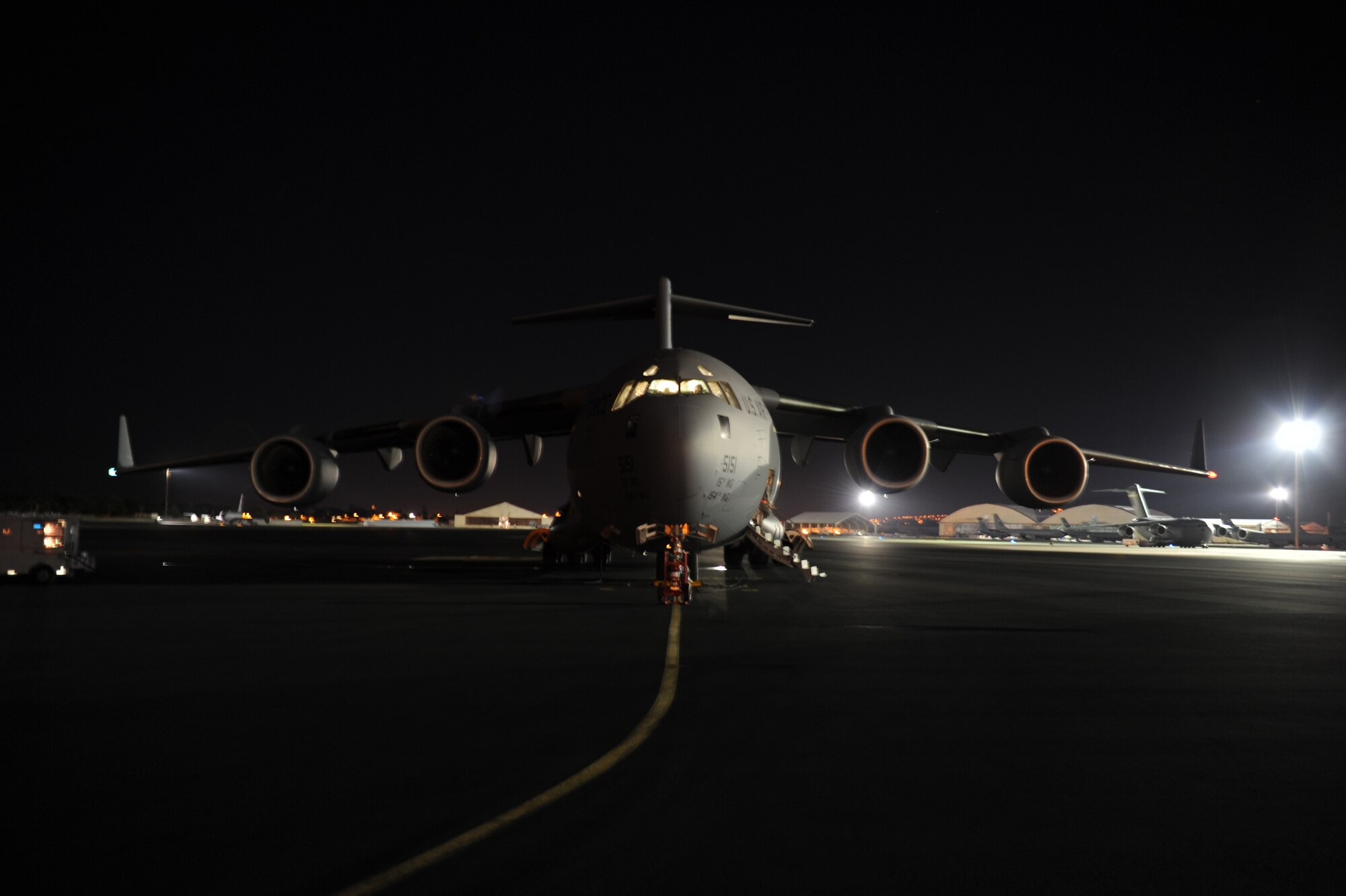 A C-17 Globemaster III sits on the flightline at Joint Base Pearl Harbor-Hickam, Hawaii, Dec. 5, 2014, while the aircrew and the Pacific Air Forces’ joint component coordination element prepare for departure inside. C-17 aircrew and JACCE demonstrated PACAF’s capability to rapidly deploy in less than 24 hours, and will continue their training alongside the 36th Wing Contingency Response Group at Andersen Air Force Base, Guam.